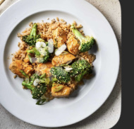 A healthy dish consisting of chicken, broccoli, brown rice, and onions, providing a balanced mix of protein, carbs, and fats.