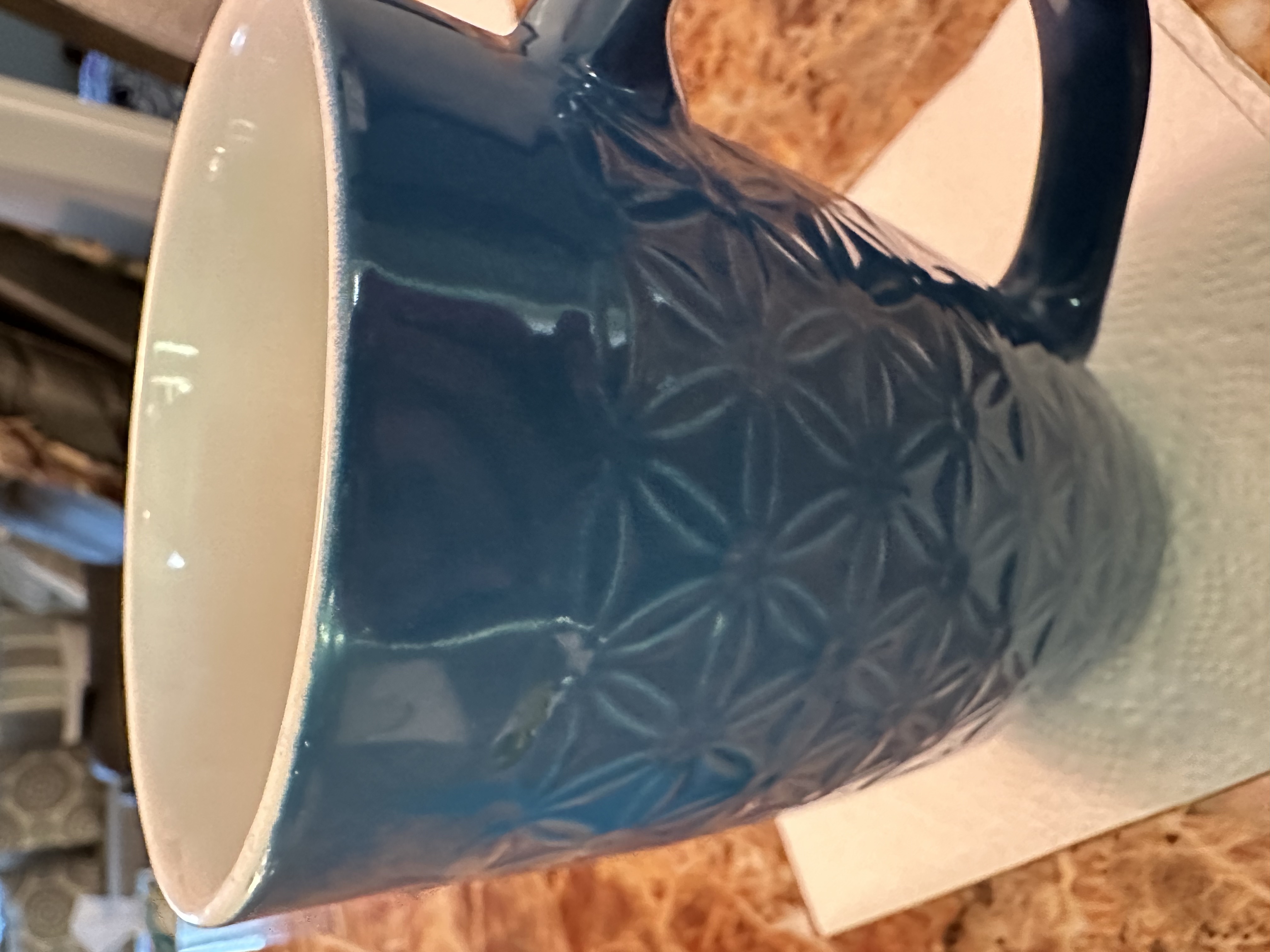 The image shows a blue mug, but no nutritional information is discernible.