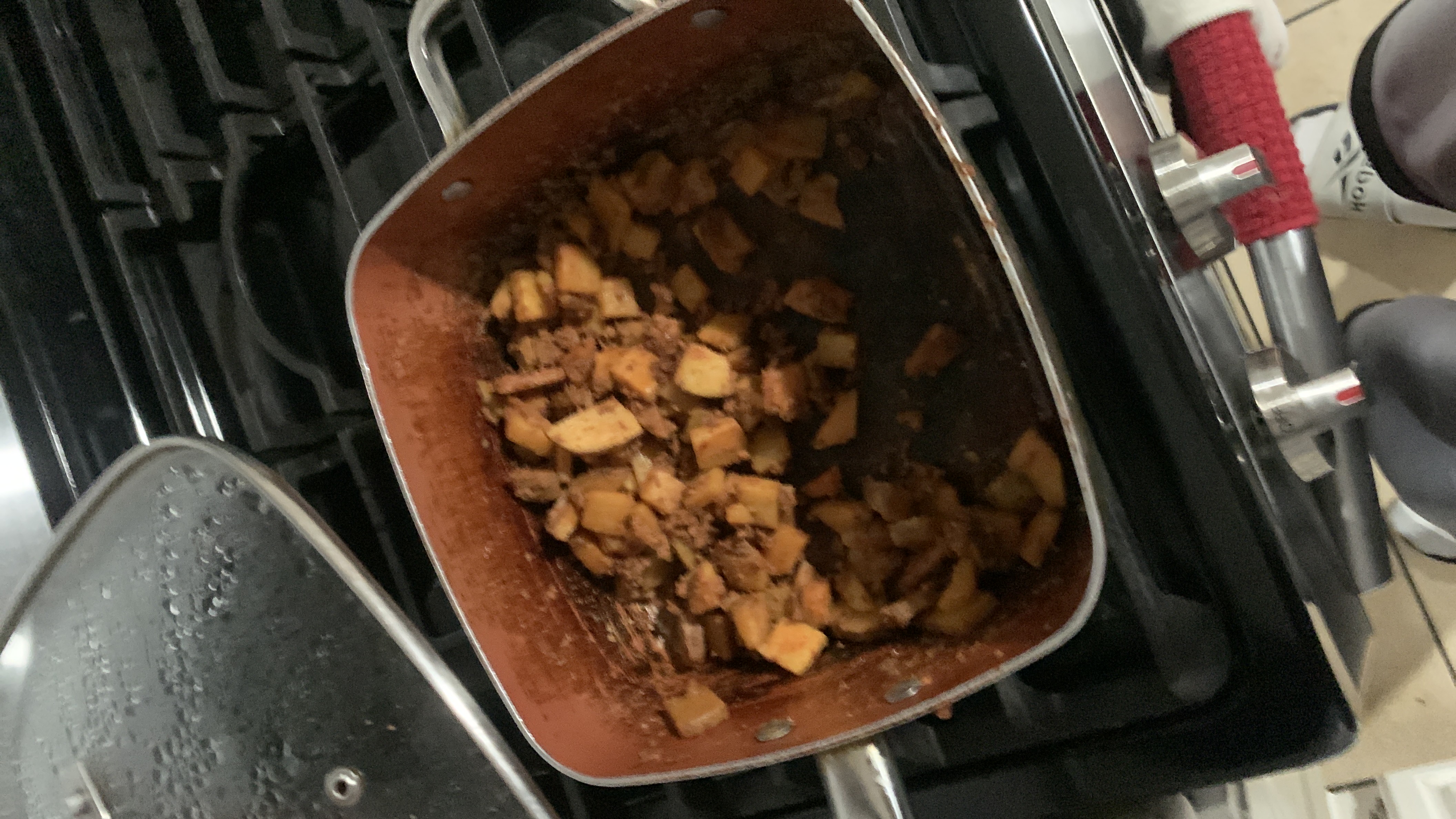 A dish consisting of sautéed potatoes and ground beef, cooked in a seasoned sauce.