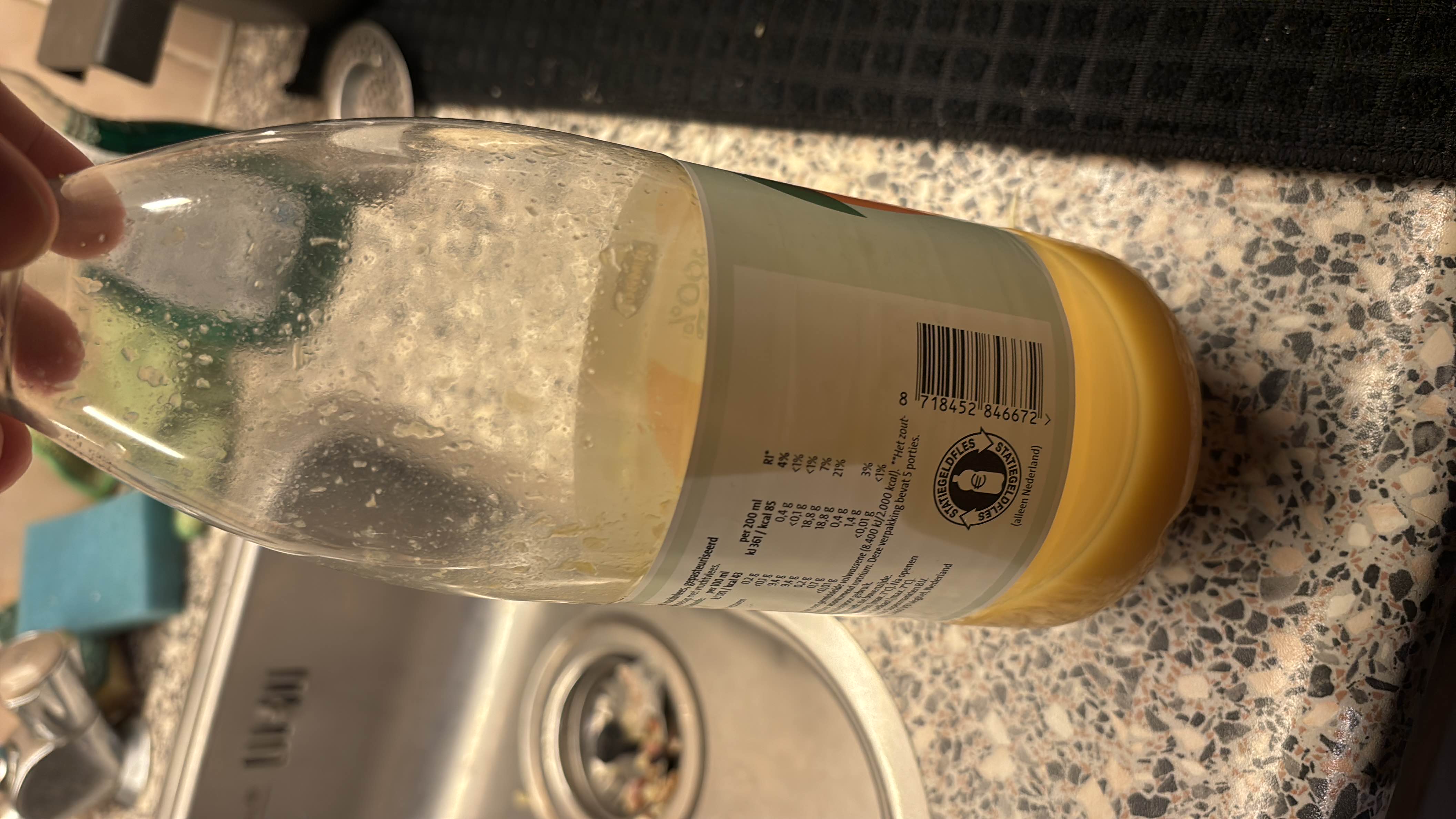 This is a bottle of orange juice with 85 calories per 200ml serving, containing 18g of carbohydrates, 1g of protein, and negligible fat.