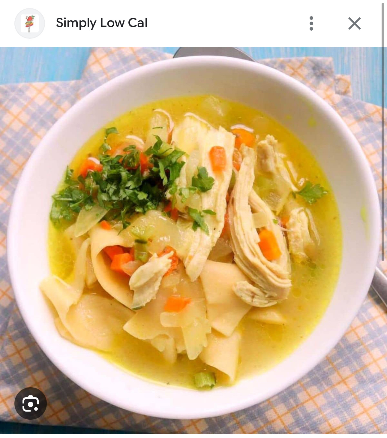 A bowl of chicken noodle soup with vegetables, offering a balanced mix of protein, carbs, and low fats.