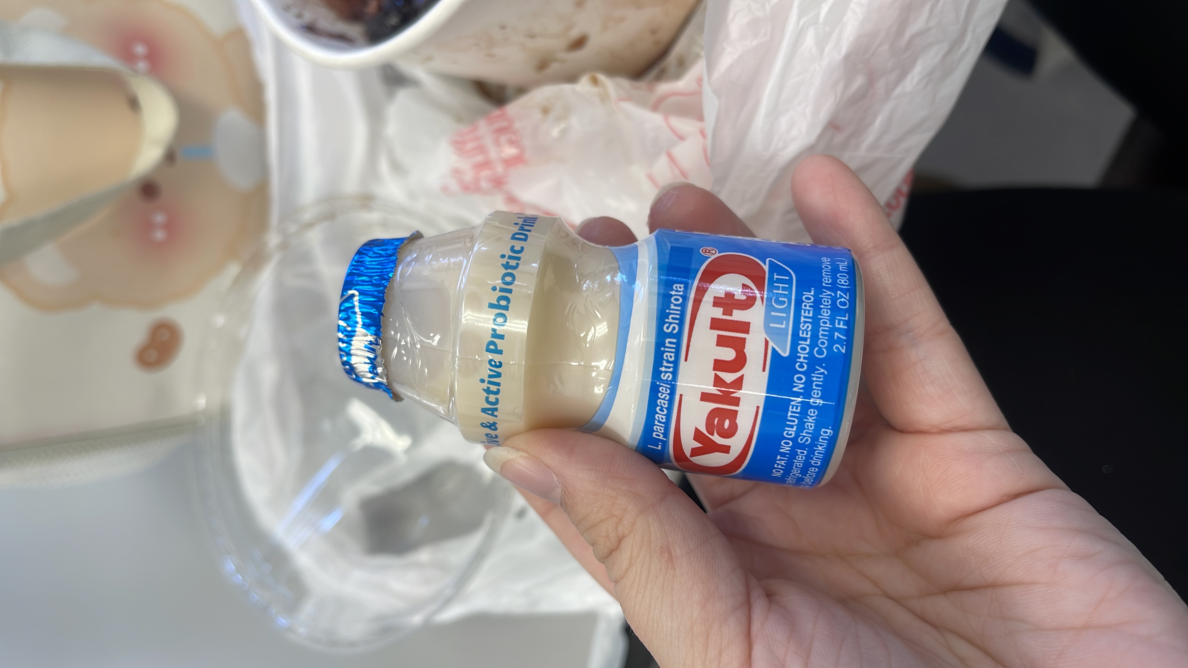 Yakult Light is a low-calorie probiotic drink containing live Lactobacillus casei Shirota cultures, with no fat, gluten, or cholesterol.
