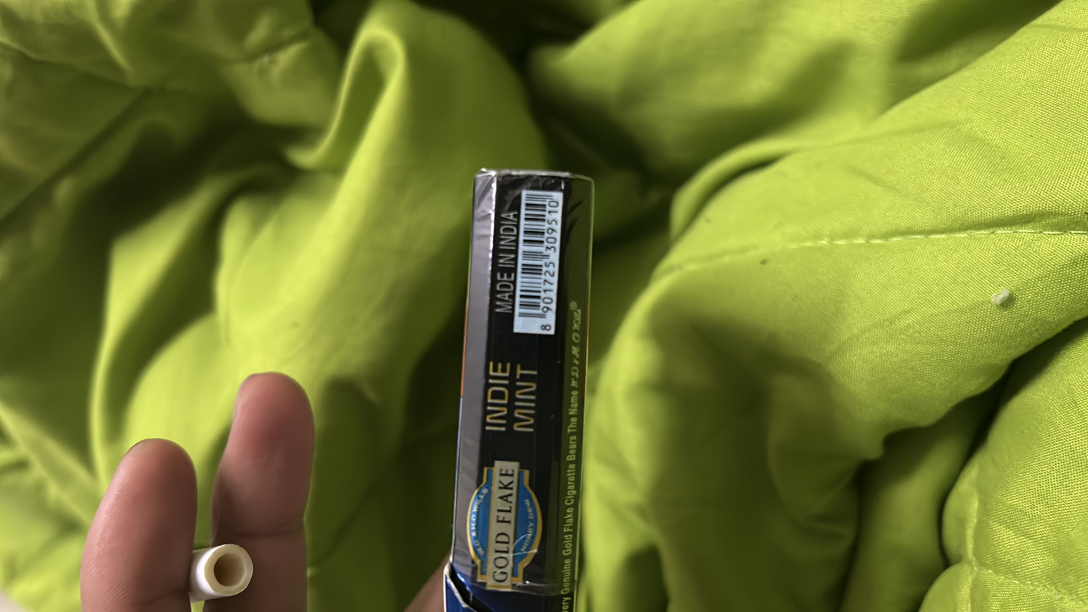 The image depicts a pack of Gold Flake Indie Mint cigarettes, which do not contain nutritional value.