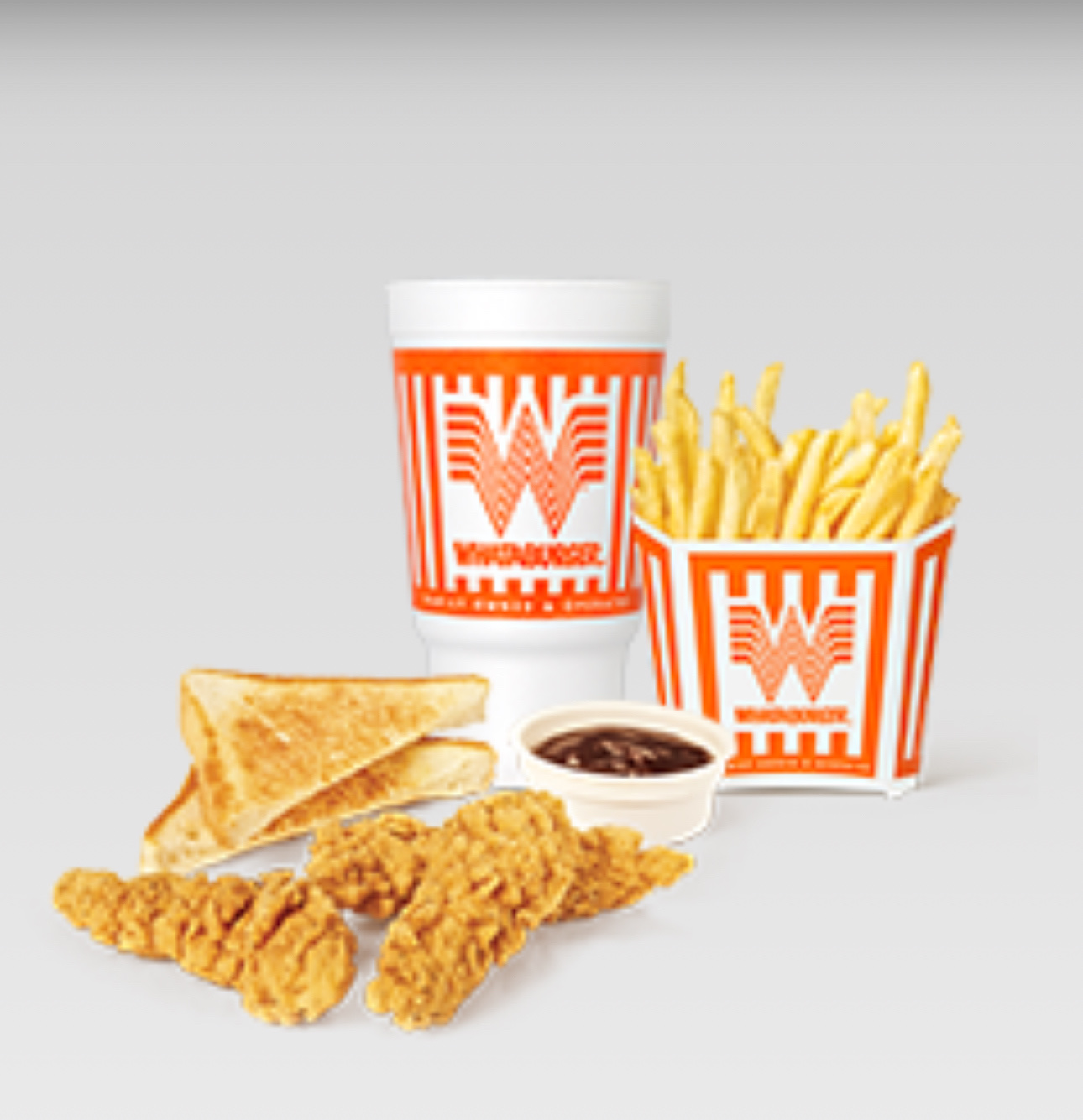 A meal consisting of chicken strips, french fries, Texas toast, dipping sauce, and a soft drink.