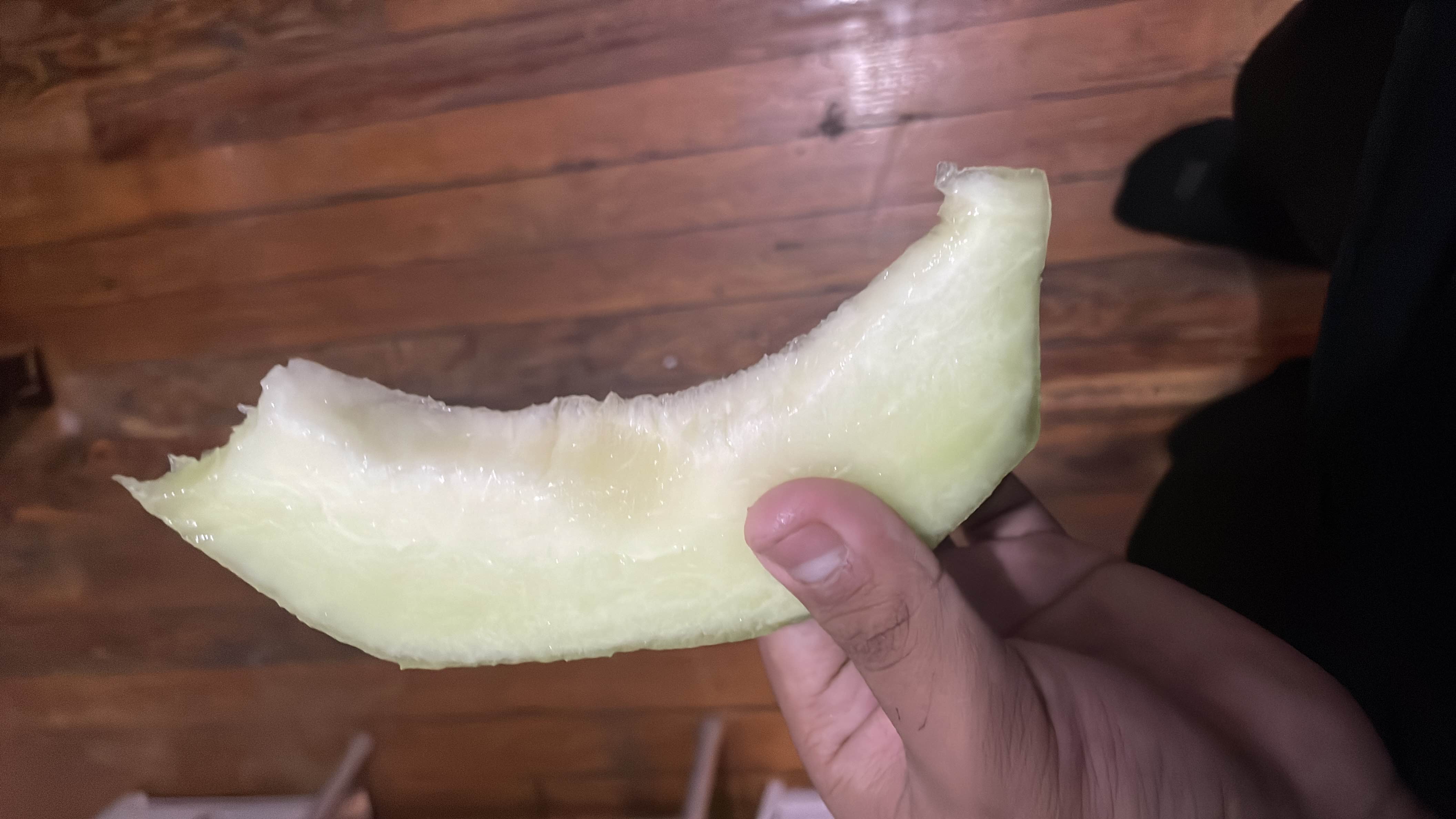 A slice of honeydew melon, a low-calorie fruit rich in water content and natural sugars.