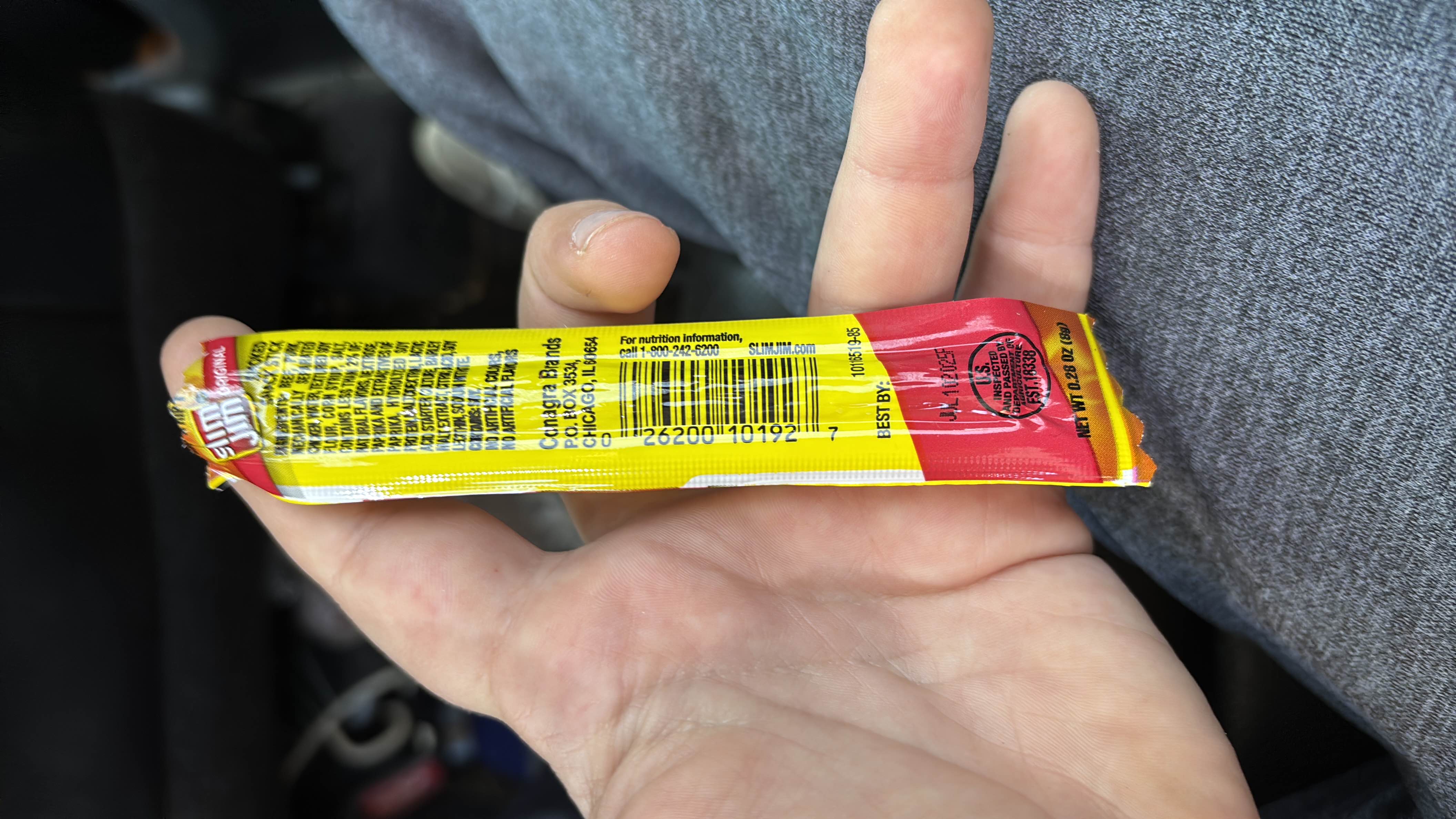 Slim Jim Original snack stick with 40 calories, 2g protein, 1g carbs, and 3g fats, made from beef, pork, and spices.