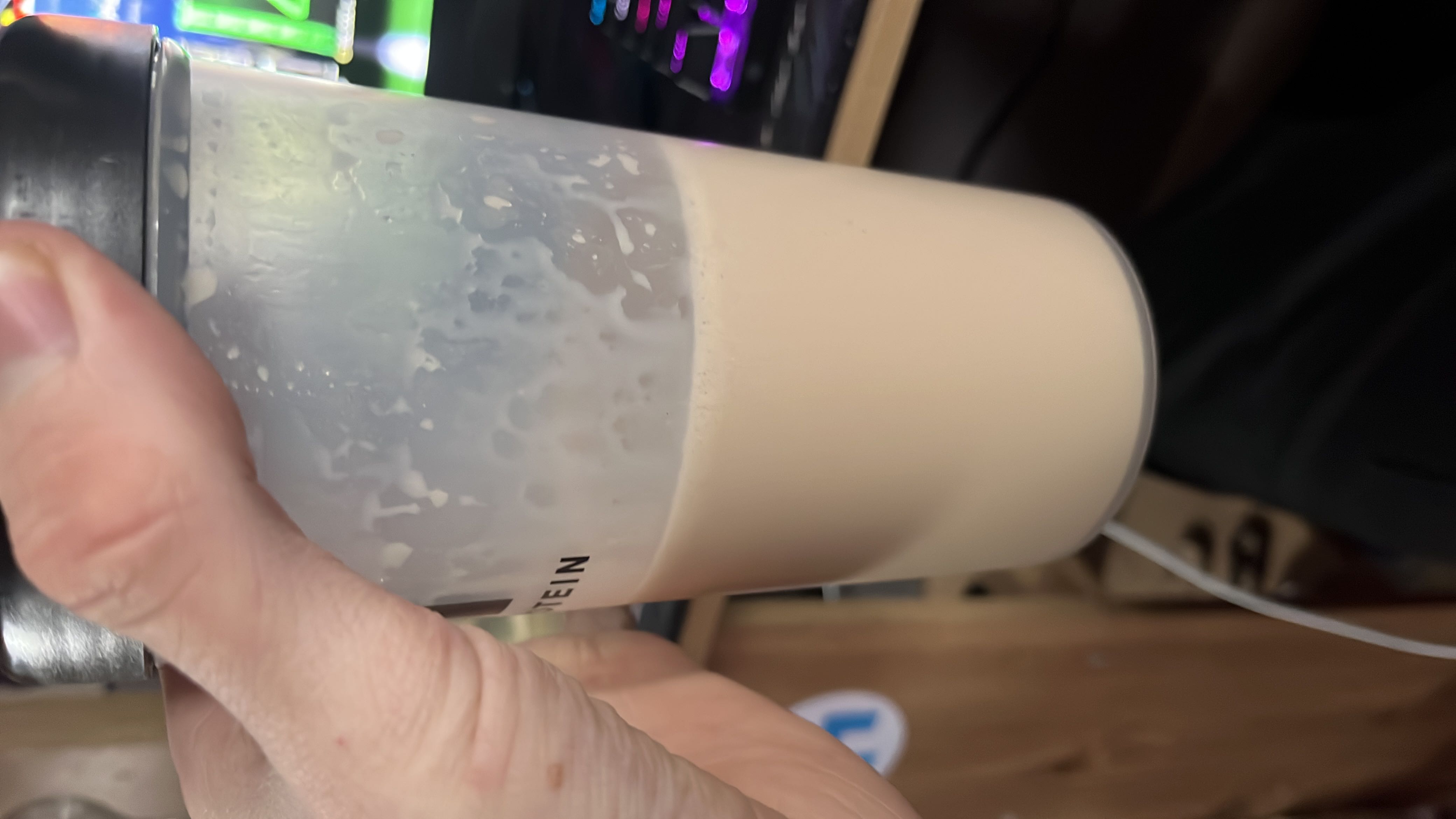 A protein shake made with protein powder and milk, providing a balanced mix of macronutrients.