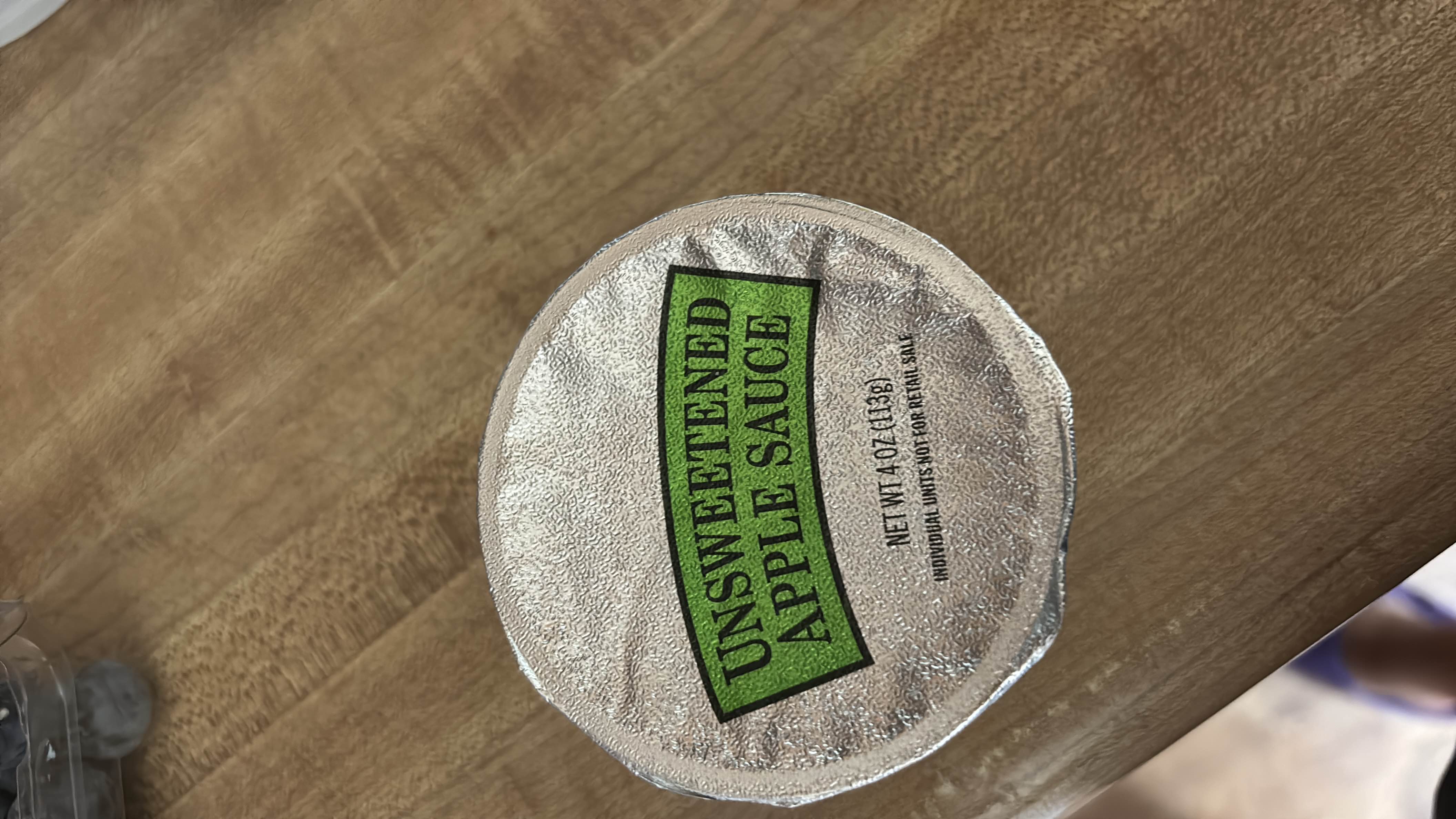 Unsweetened apple sauce with 50 calories per serving, primarily composed of apples and containing no added sugars or fats.