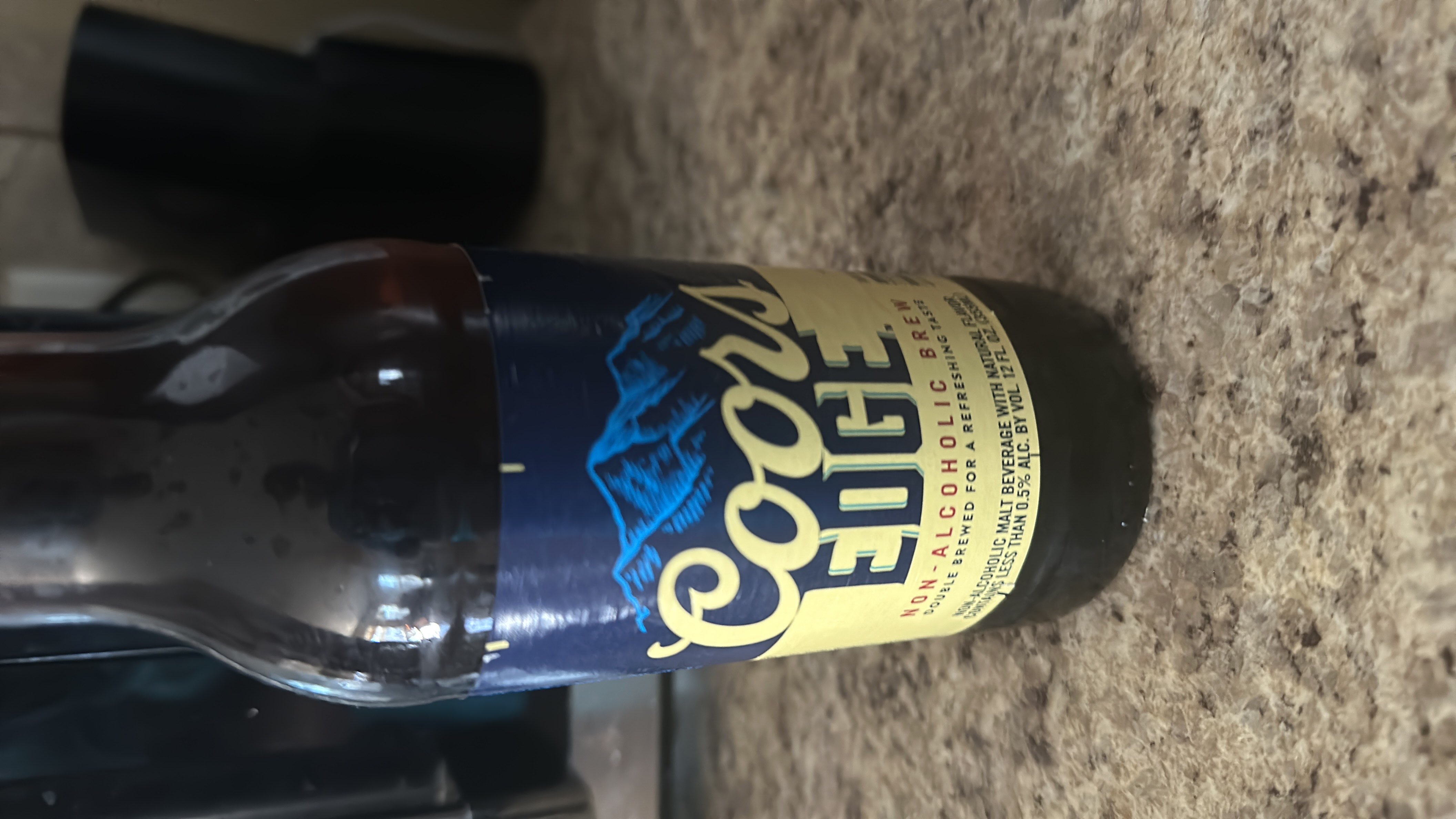 Coors Edge is a non-alcoholic brew with 45 calories per serving, containing minimal protein and fats, and primarily composed of carbohydrates.