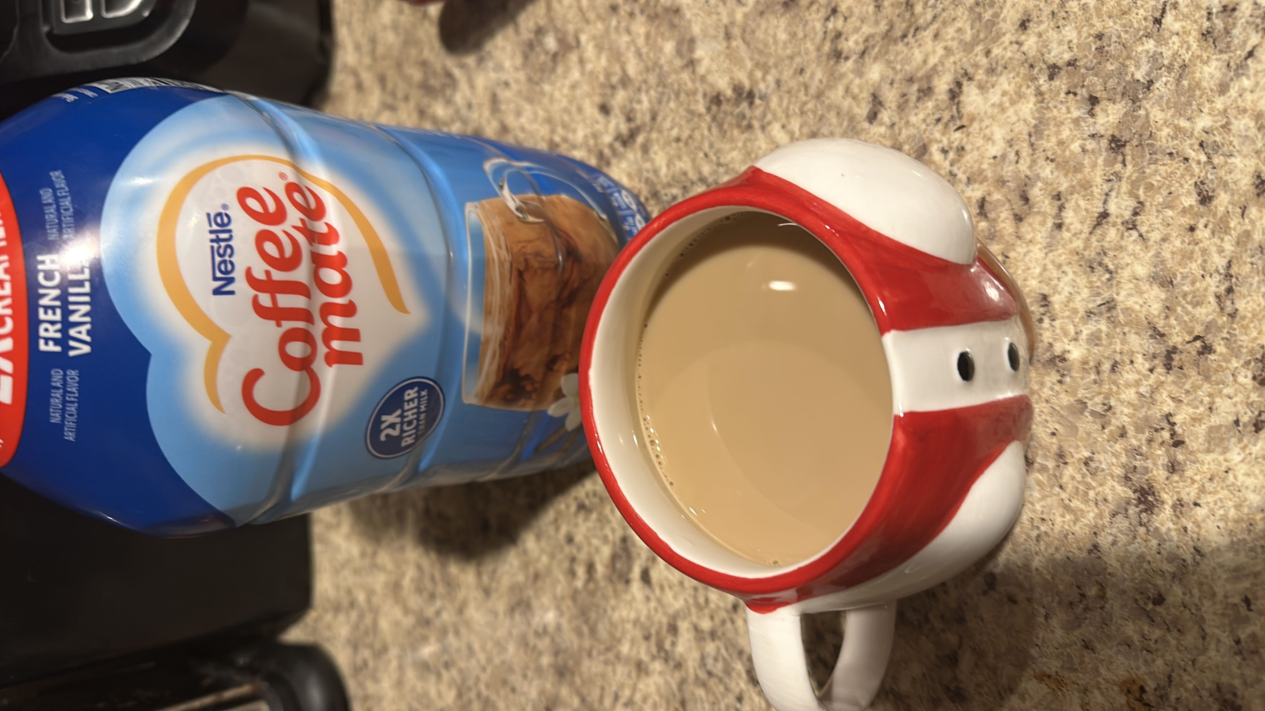 A cup of coffee with French Vanilla Coffee-Mate creamer, providing a sweet and creamy flavor with moderate calories.