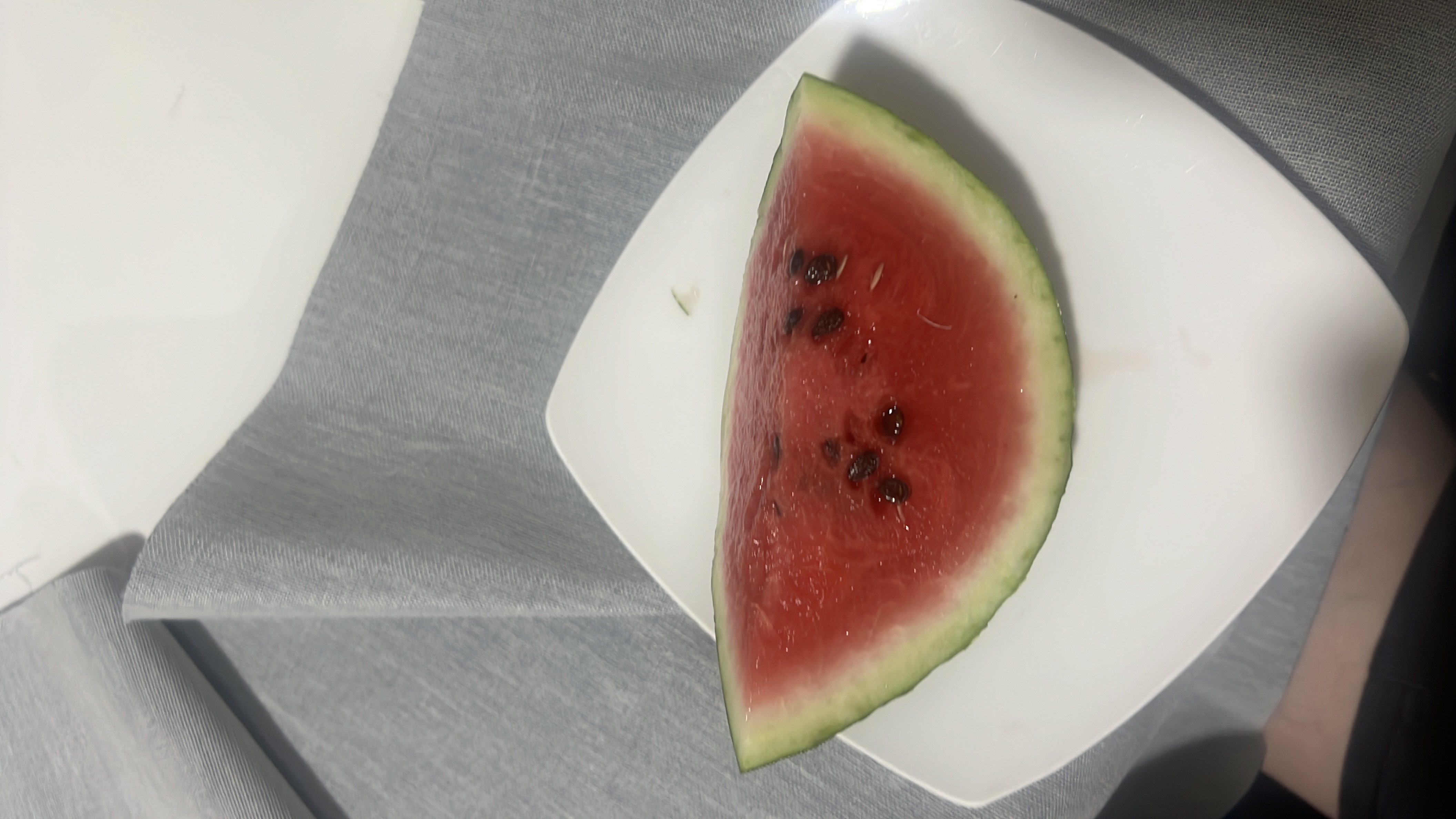 A slice of watermelon, a low-calorie fruit rich in water content and essential nutrients.