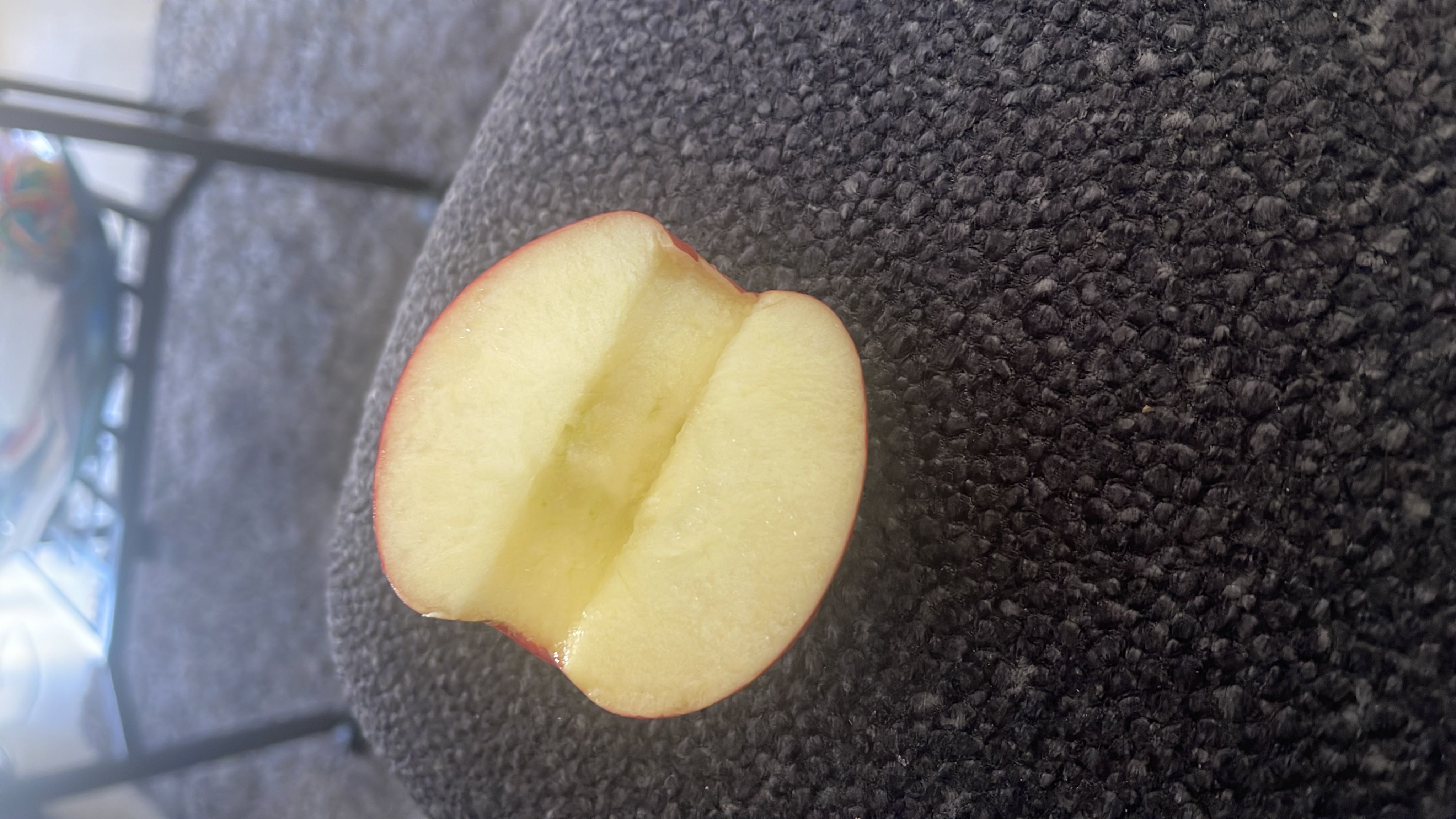 The image shows a sliced apple, which is a nutritious fruit rich in carbohydrates and low in fats and protein.