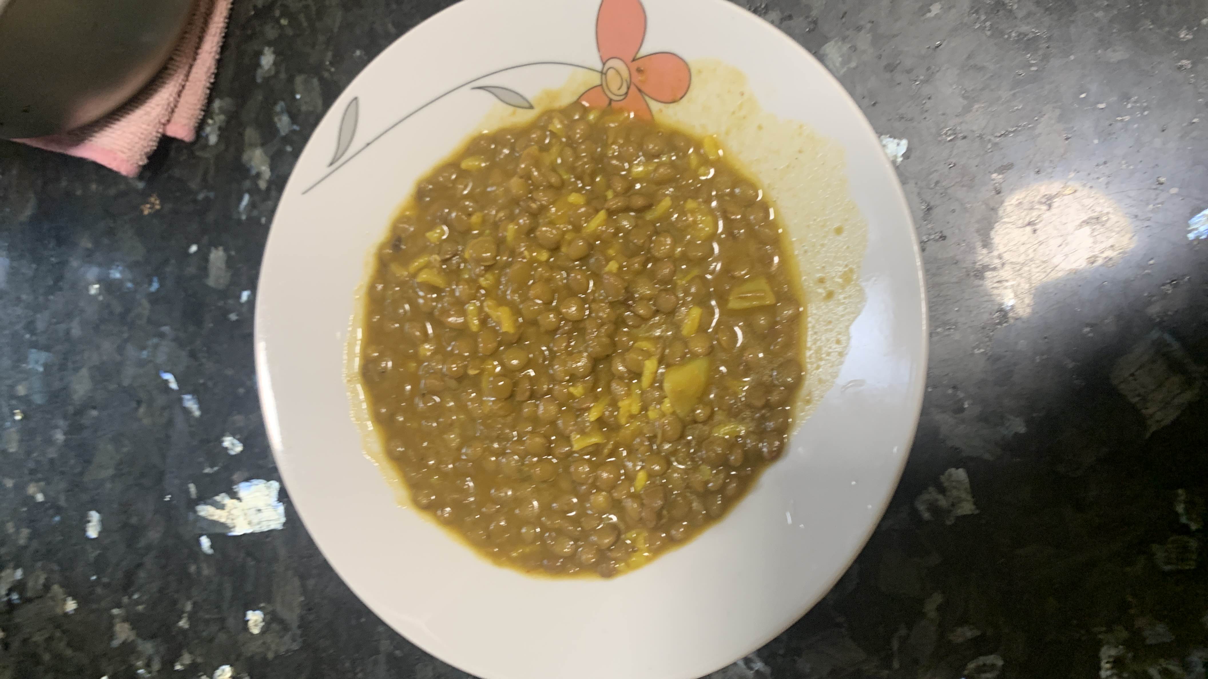 A nutritious lentil dish cooked with spices and a small amount of oil, providing a balanced mix of protein, carbs, and fats.