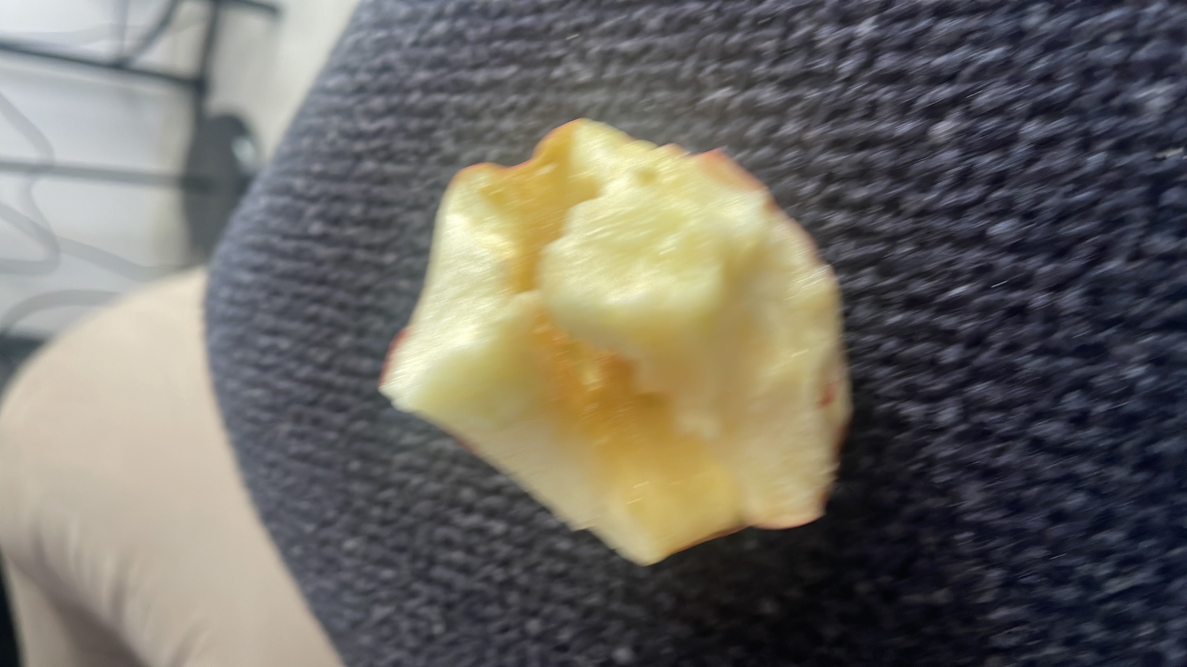 The image shows a partially eaten apple, which is a healthy snack option with moderate calories and high carbohydrate content.