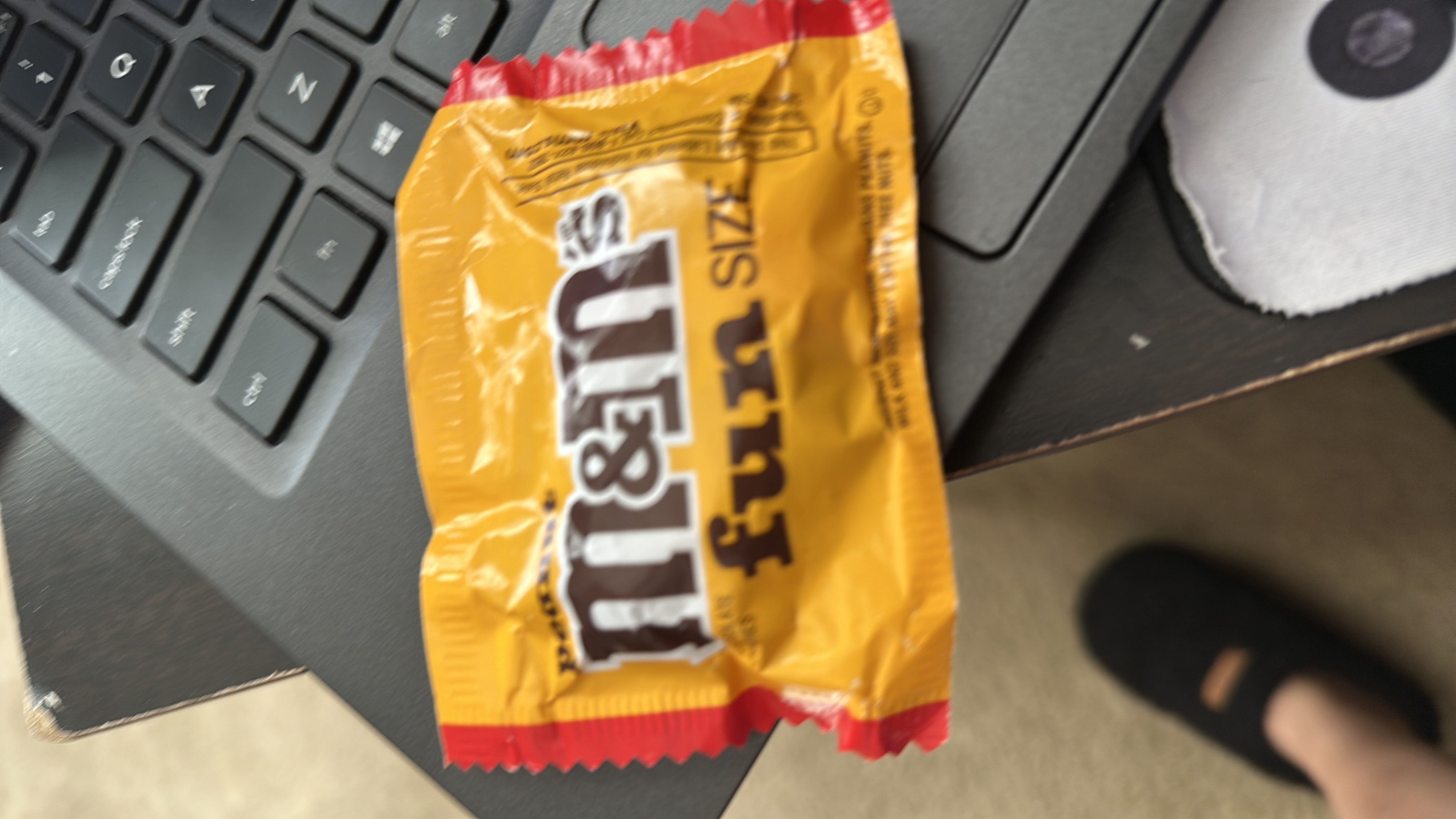 This is a fun-size pack of peanut M&M's, containing 90 calories per serving with a mix of protein, carbs, and fats.