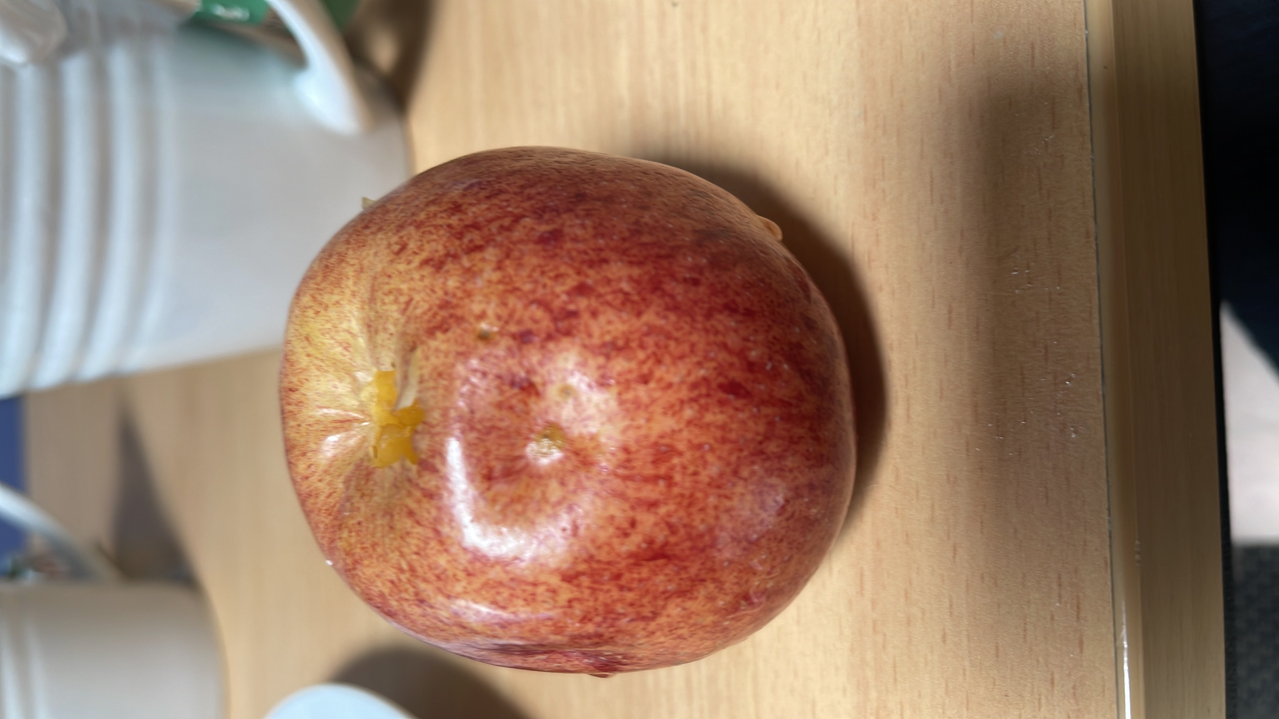 The image shows an apple, a nutritious fruit that is low in calories and fats, and high in carbohydrates.