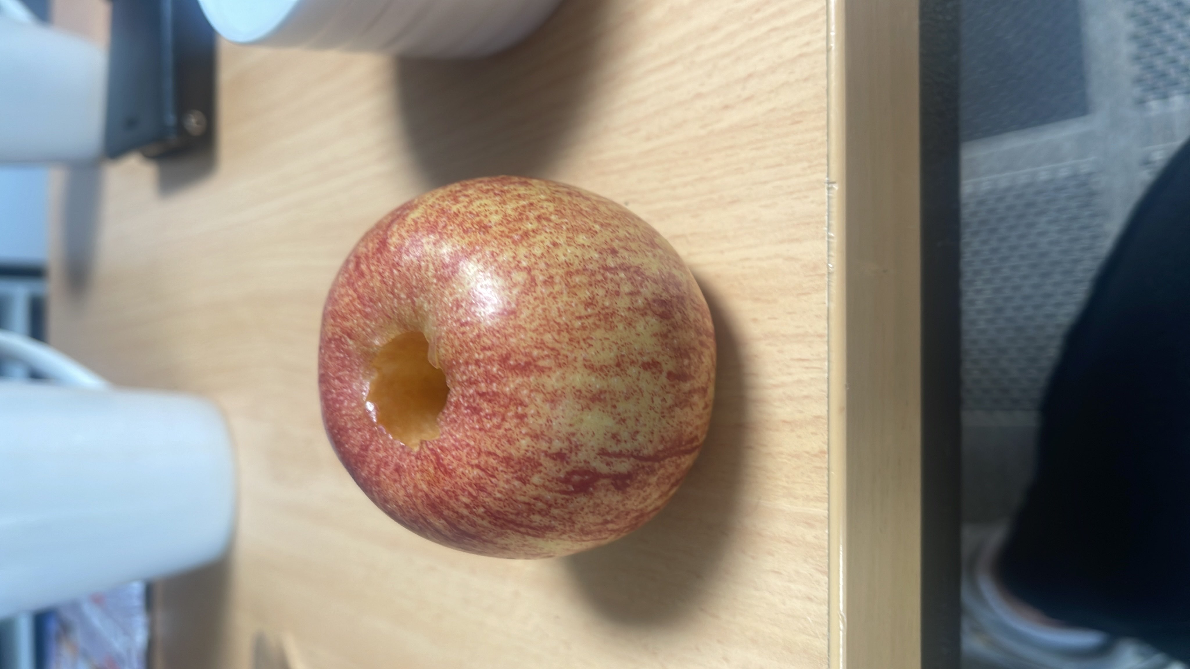 The image shows an apple, which is a nutritious fruit rich in carbohydrates and low in fats and protein.