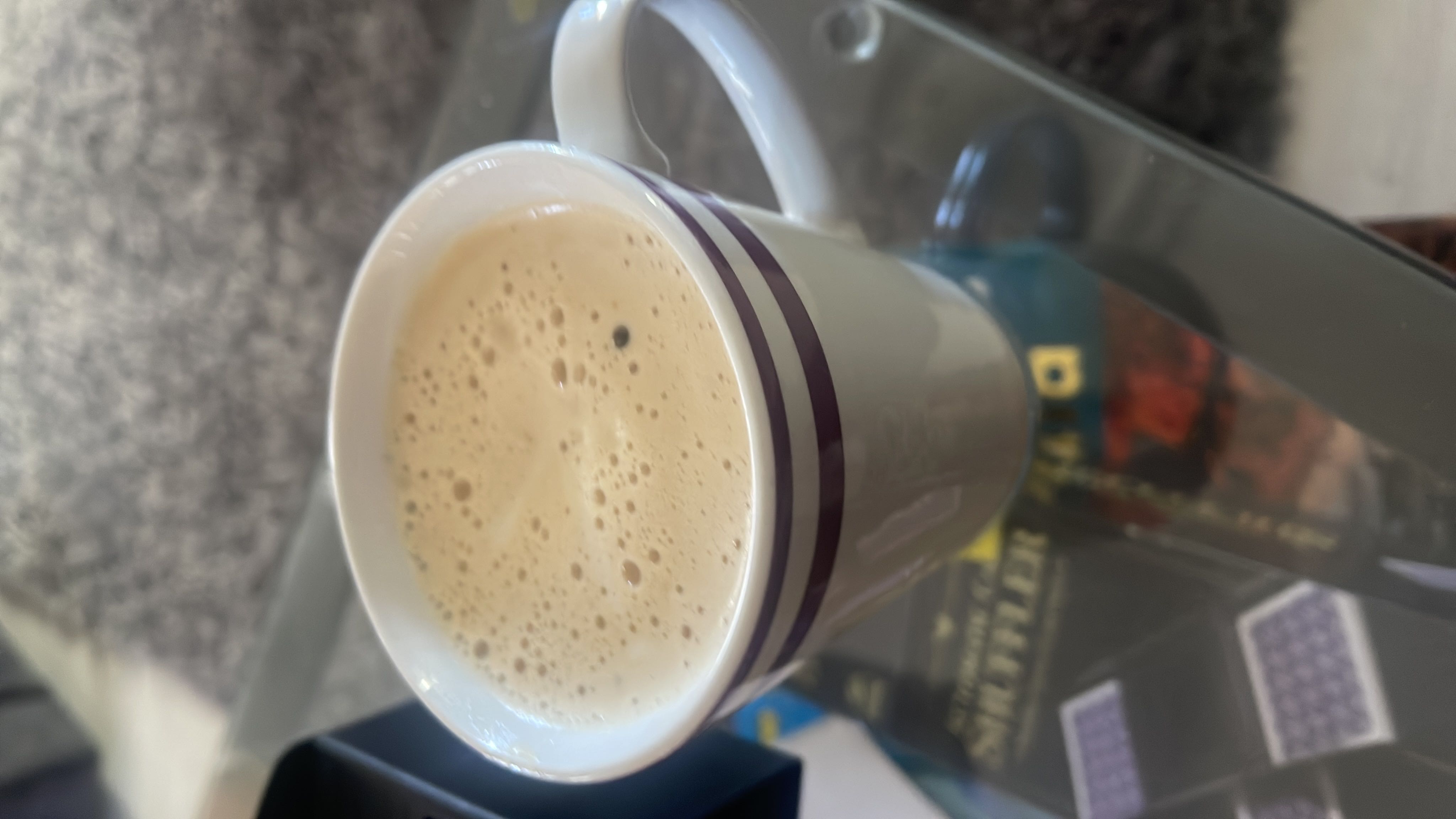 A cup of coffee with milk and sugar, providing a moderate calorie count and a balanced nutritional profile.