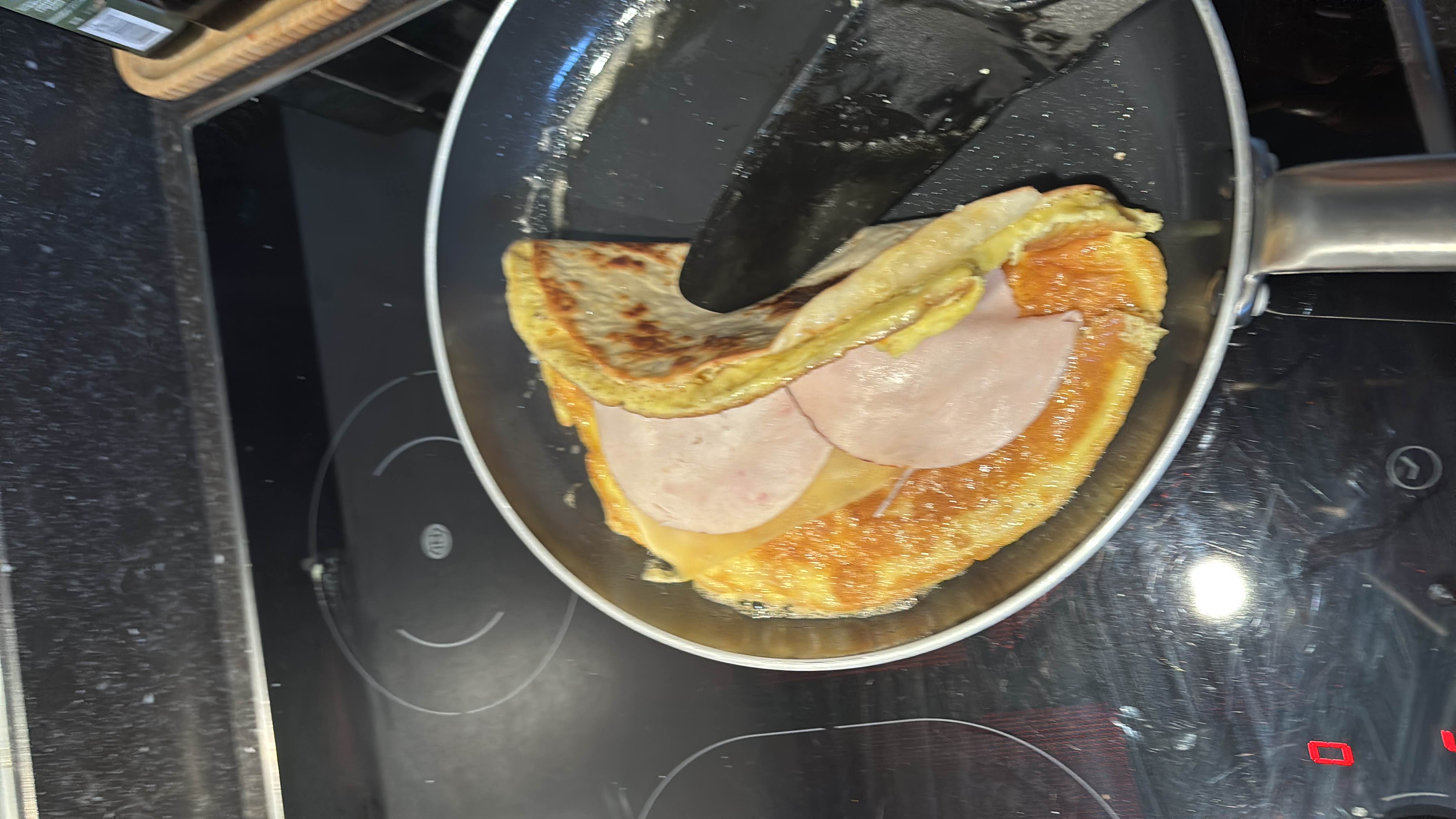 A savory omelette filled with chicken fillet and cheese, wrapped in a tortilla.