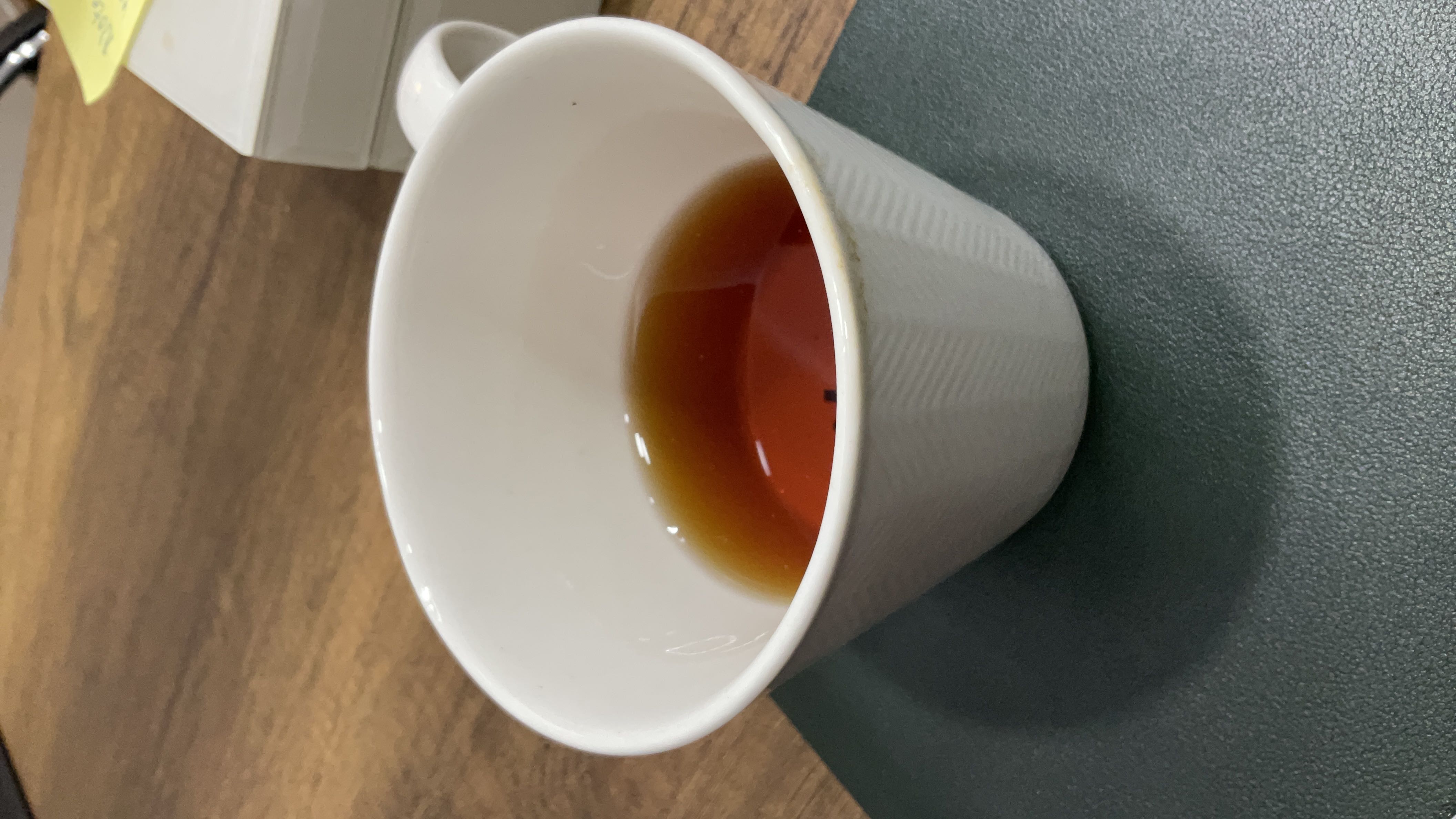 A cup of black tea with minimal calories, no fats, and no protein, making it a healthy beverage choice.