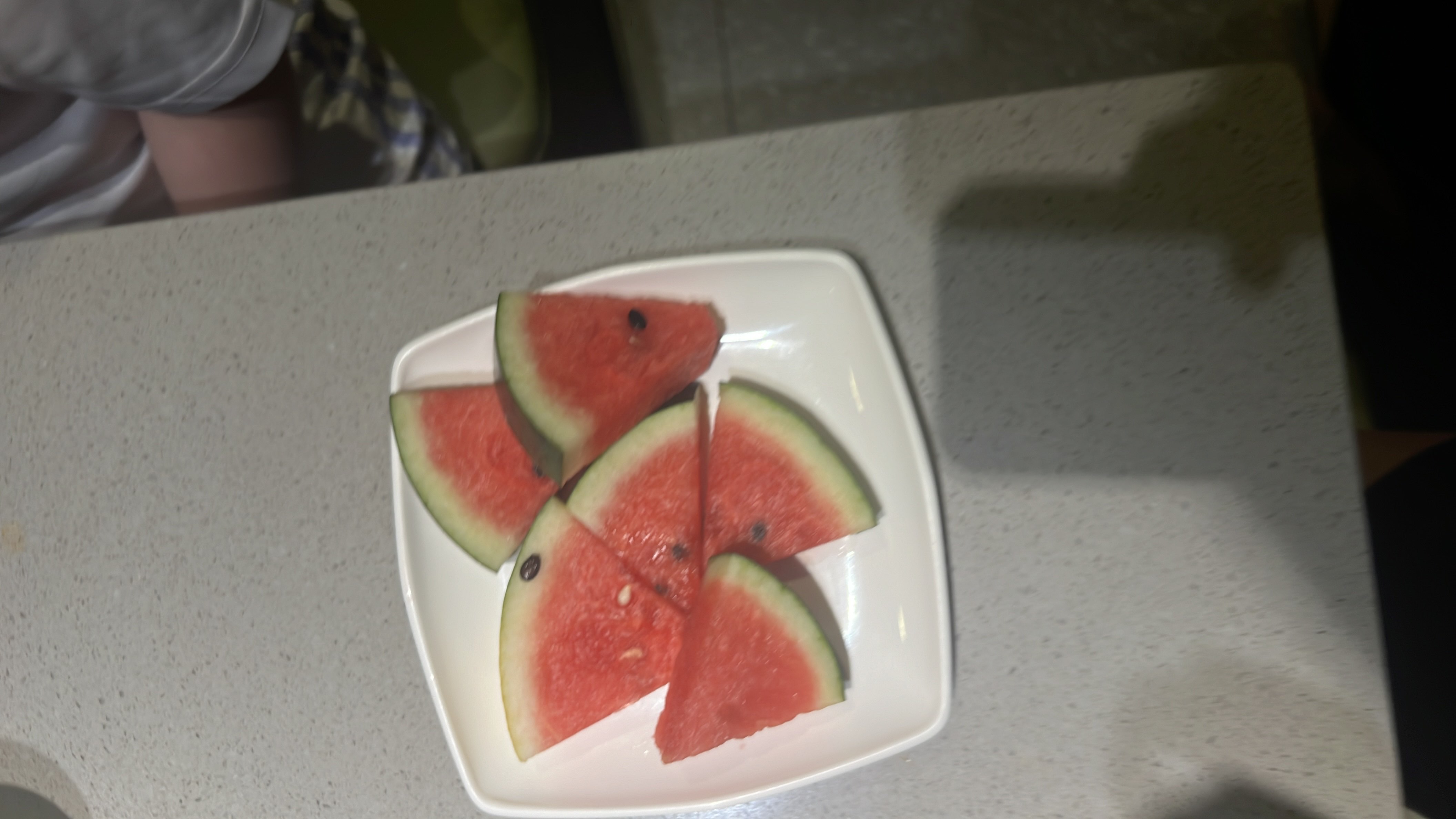 The image shows slices of watermelon, a low-calorie fruit rich in water content and nutrients.