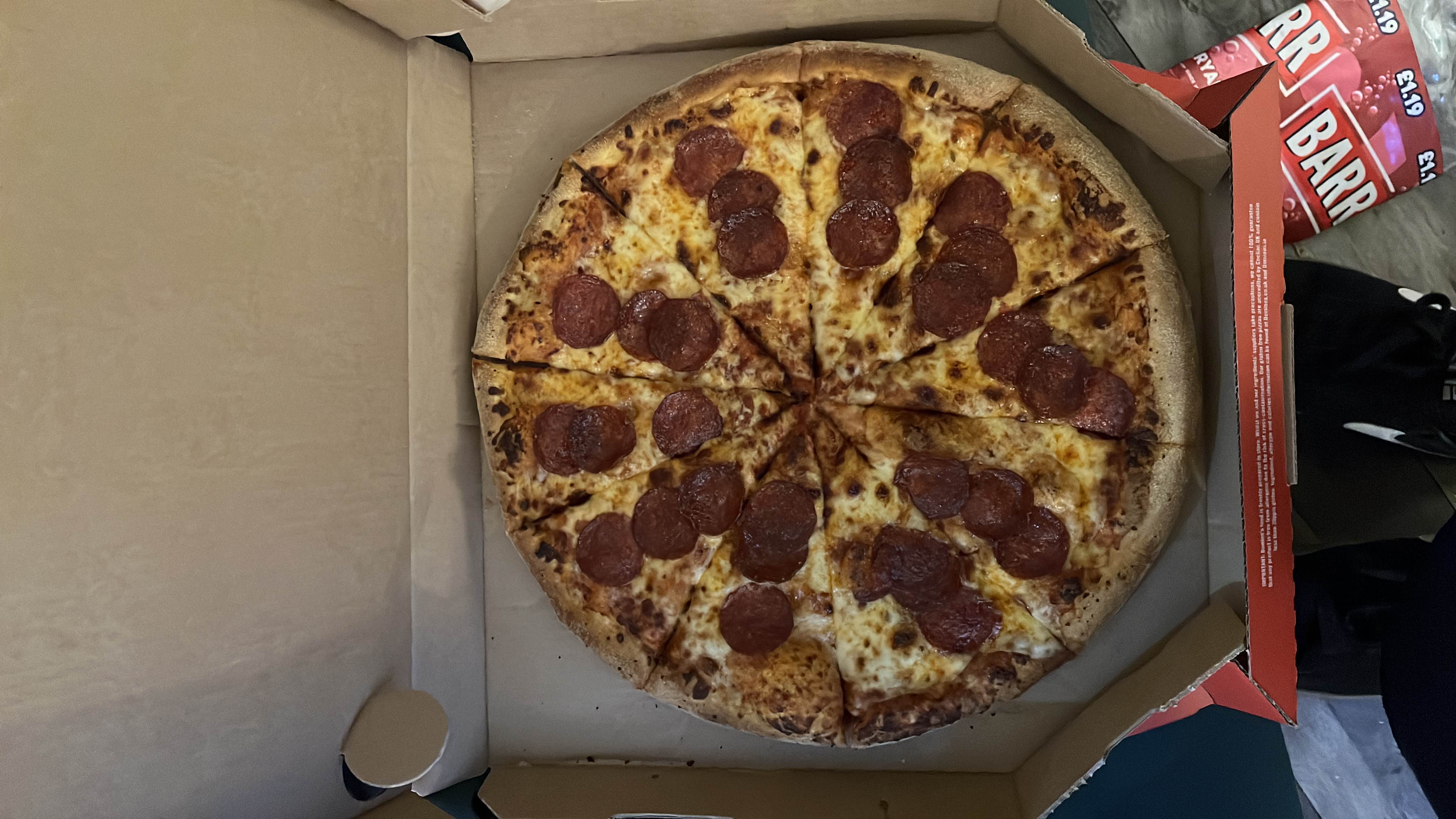 A pepperoni pizza with cheese and a crispy crust, providing a balanced mix of protein, carbs, and fats.