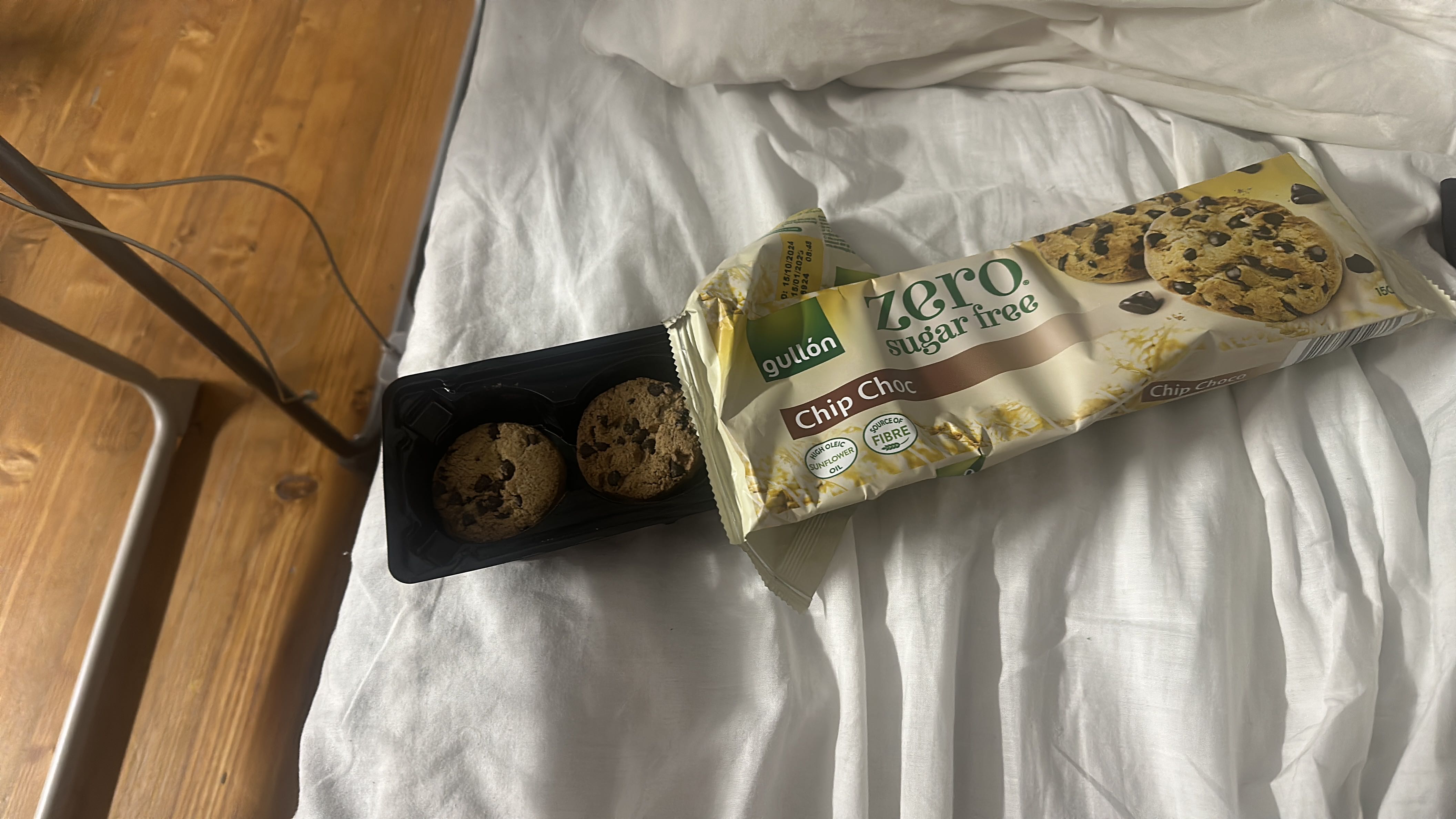 The image shows a package of sugar-free chocolate chip cookies, which are marketed as a healthier snack option.