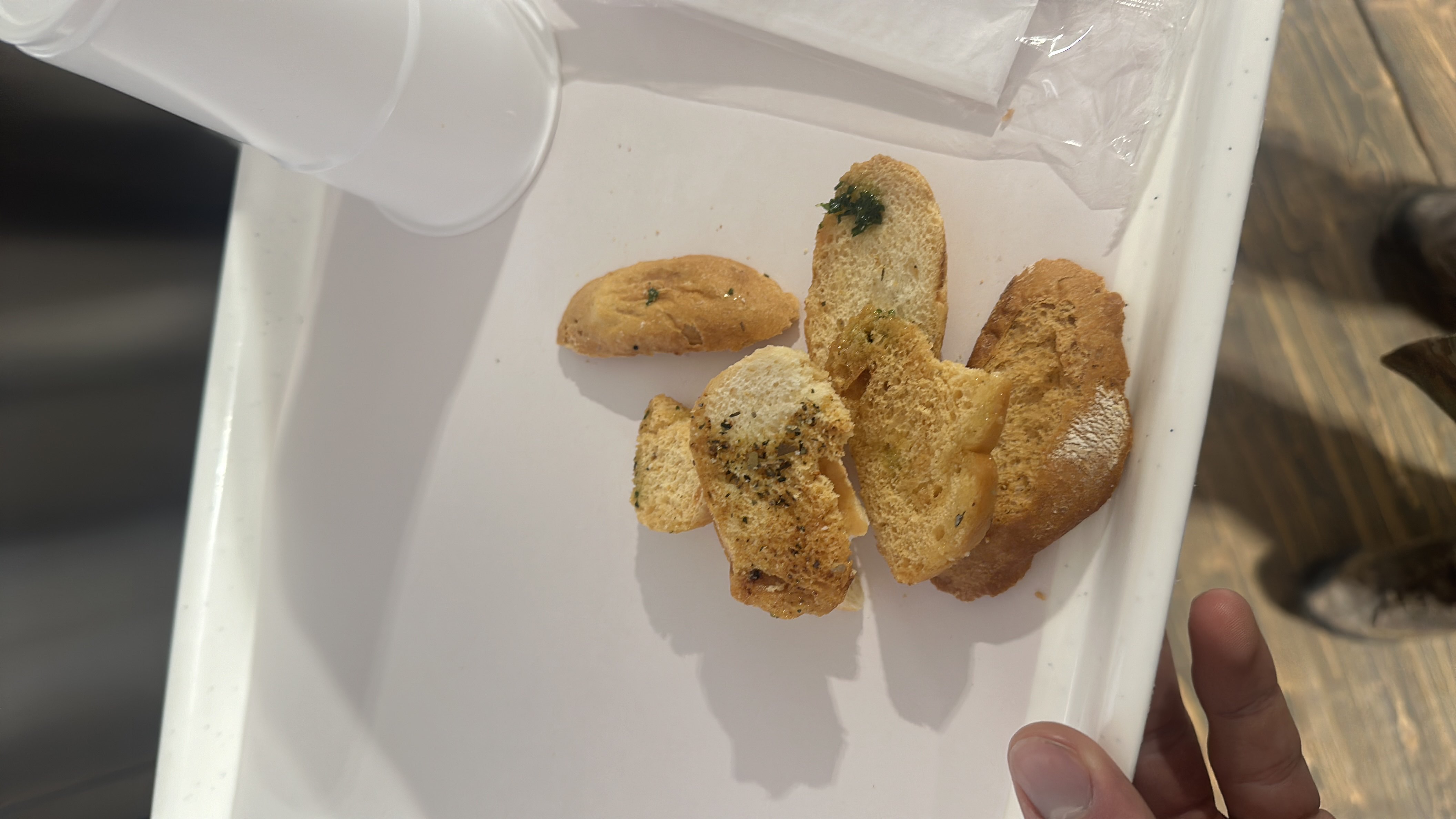 Crispy slices of bread seasoned with herbs, providing a moderate carbohydrate source.