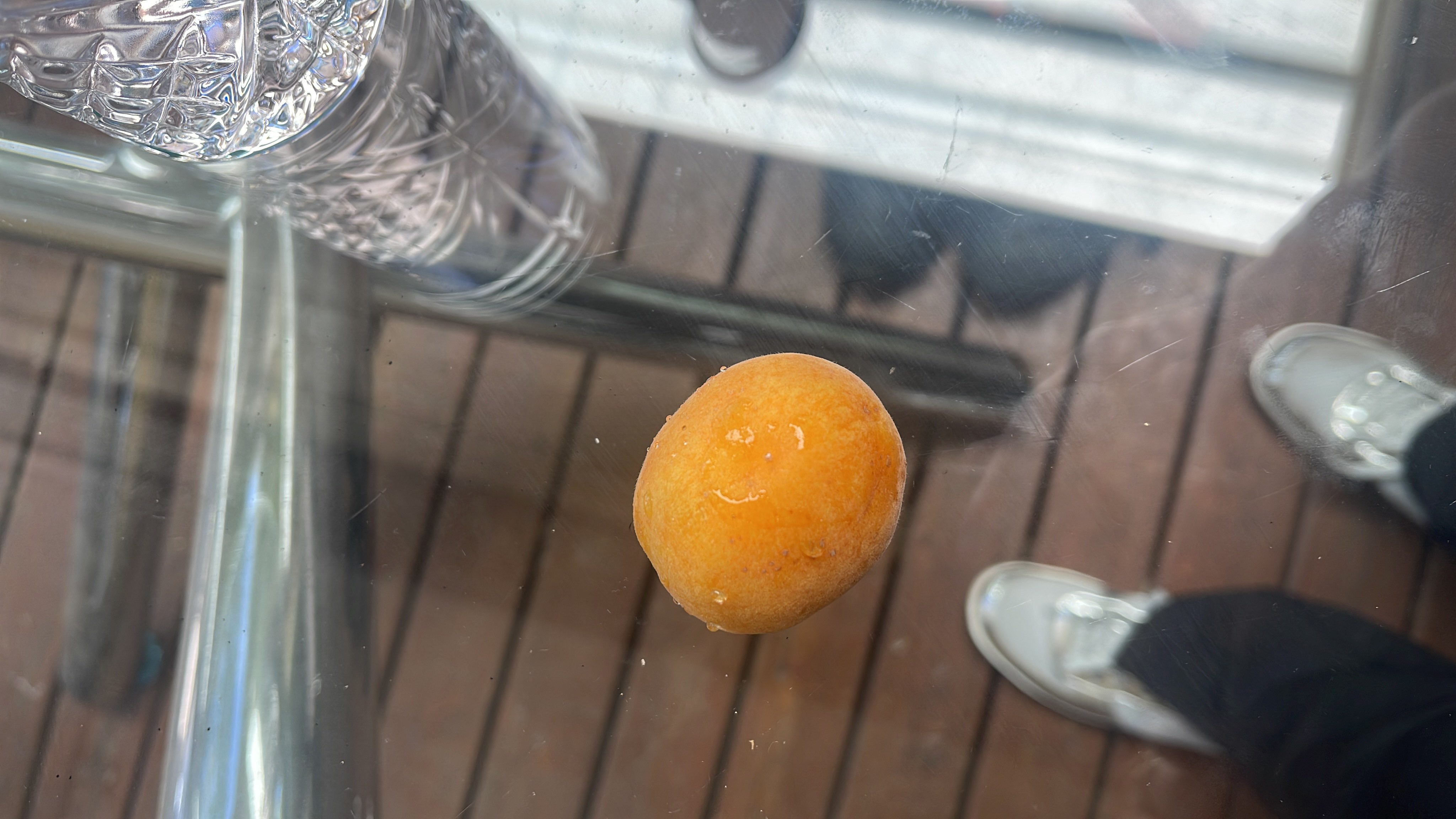 A small orange fruit, likely an apricot, with moderate calories and minimal fats.