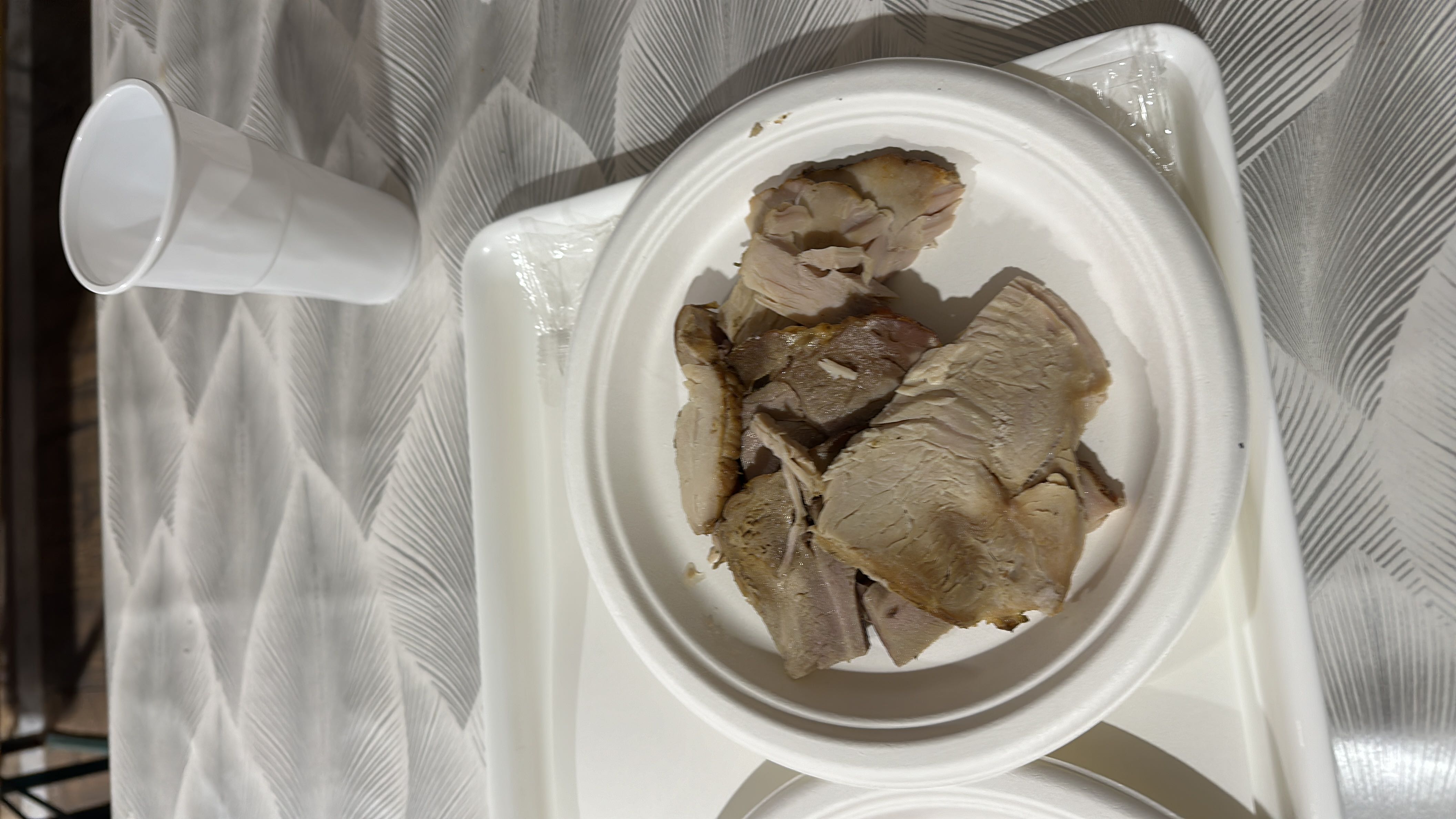Slices of cooked pork with moderate protein content.