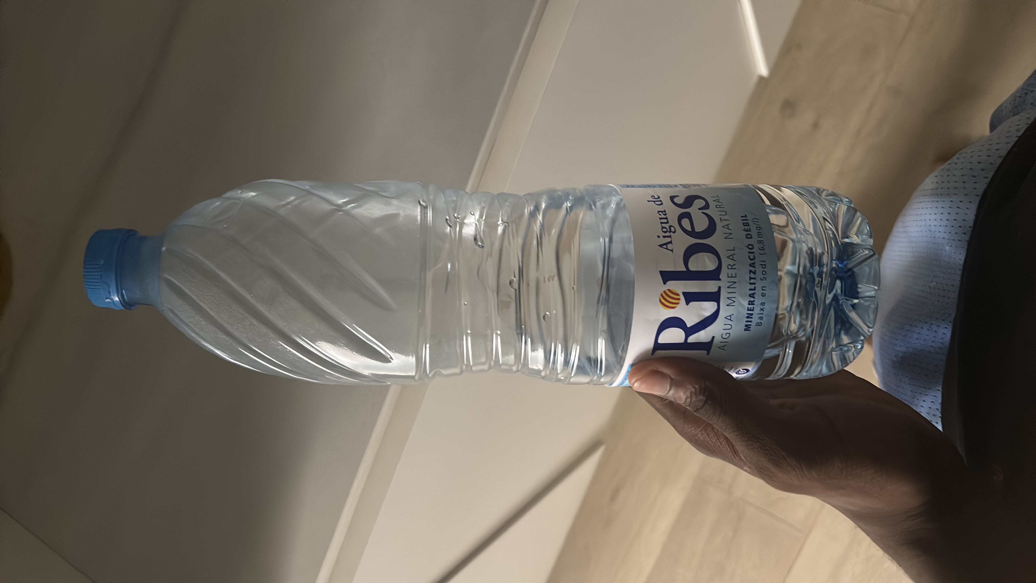 A bottle of mineral water with no significant nutritional content.