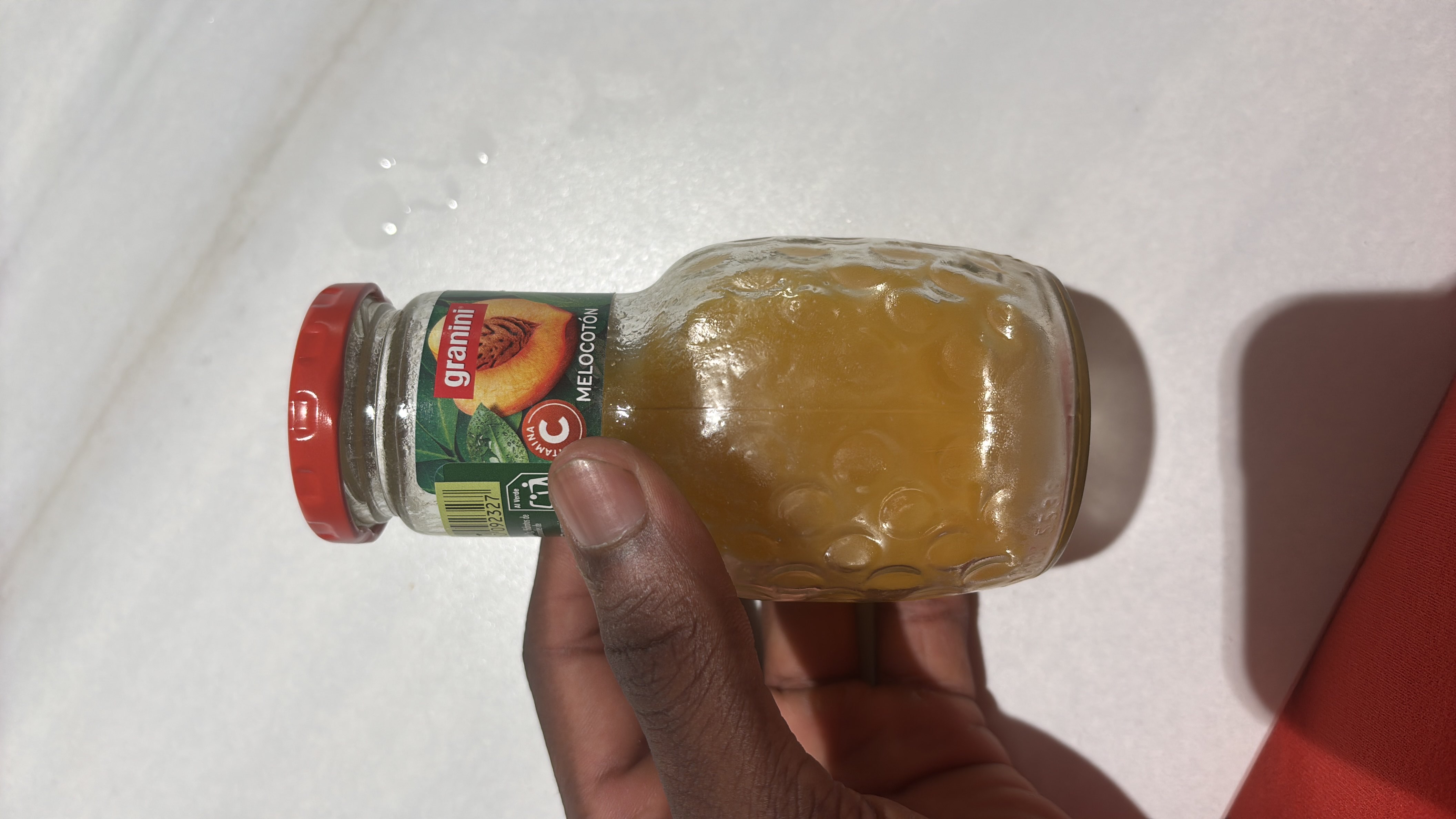 A peach juice drink with moderate calories and vitamin C content.