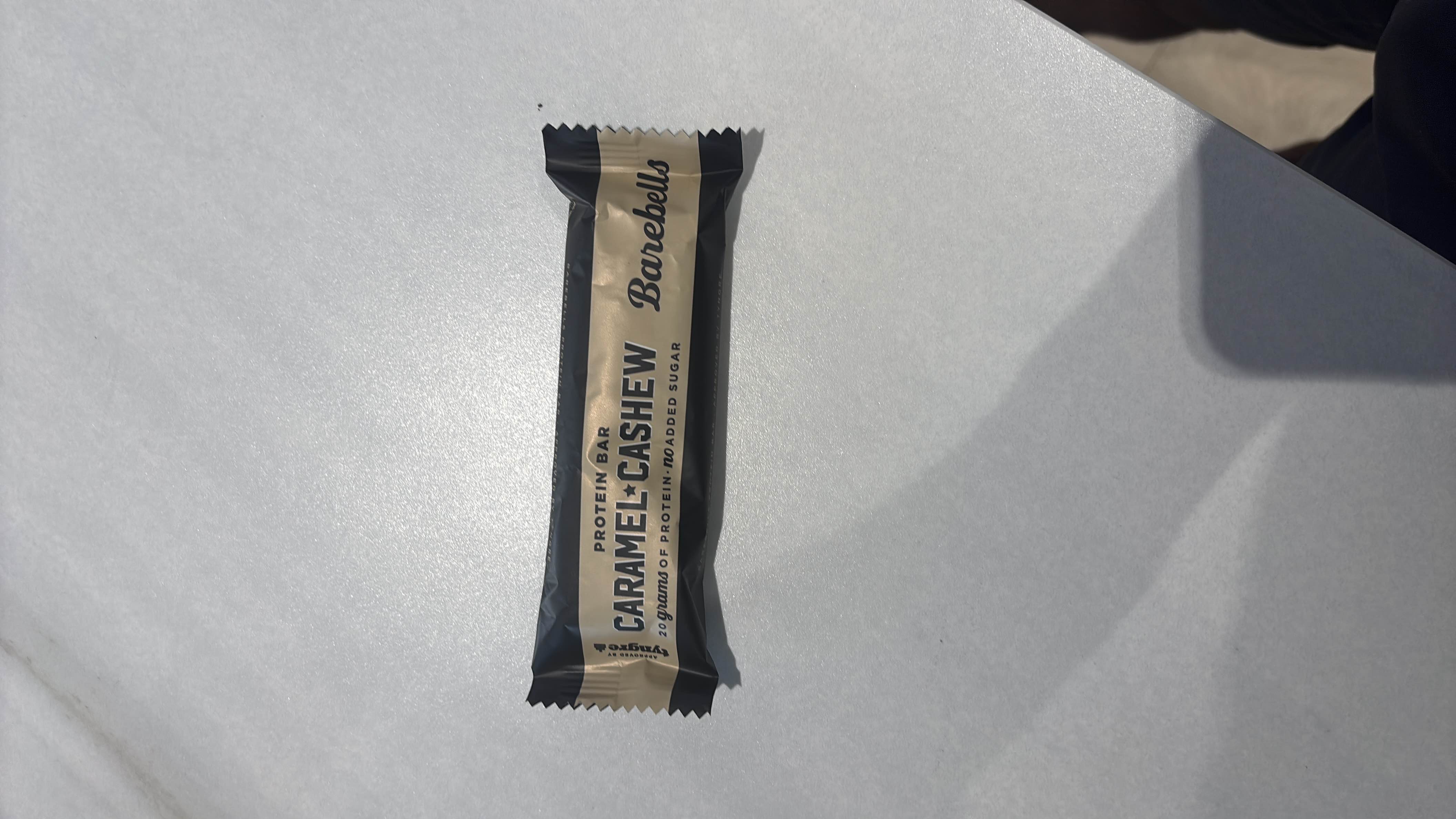 A caramel cashew protein bar with 20 grams of protein and no added sugar, offering a balanced nutritional profile.