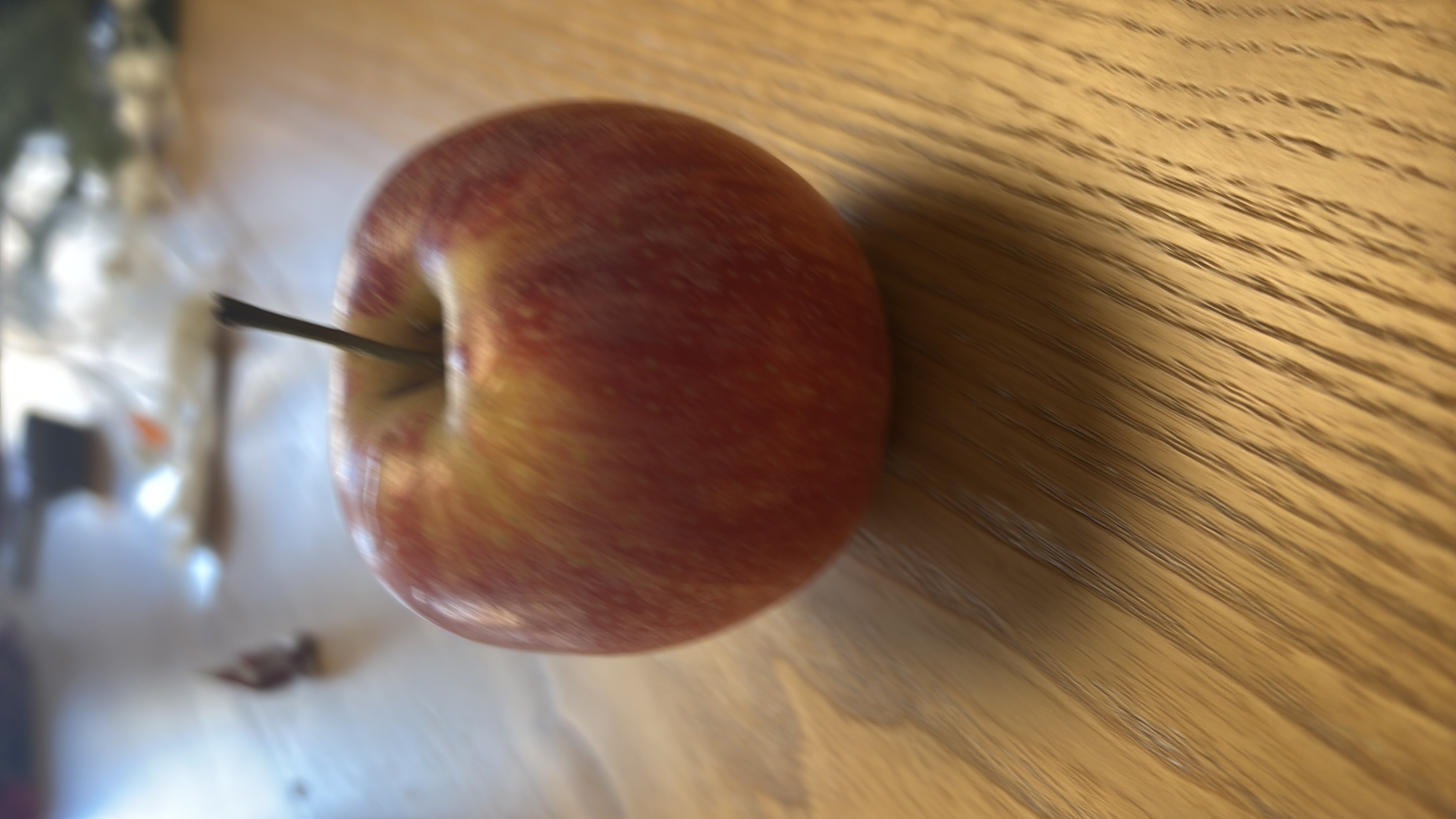 The image shows a fresh apple, which is a nutritious fruit rich in carbohydrates and low in fats and protein.