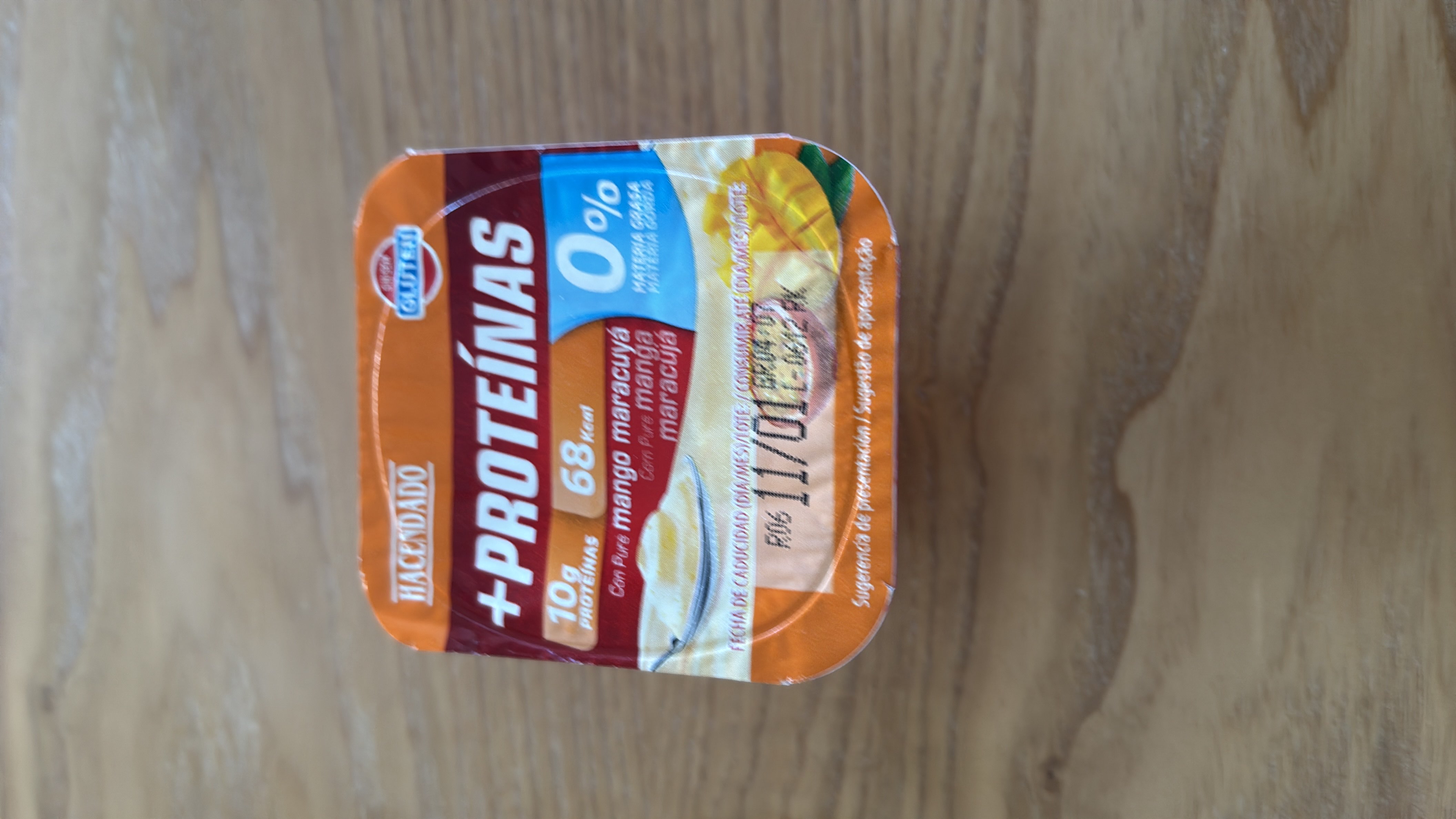 A high-protein yogurt with mango and passion fruit puree, containing 68 calories, 10g of protein, and 0% fat.