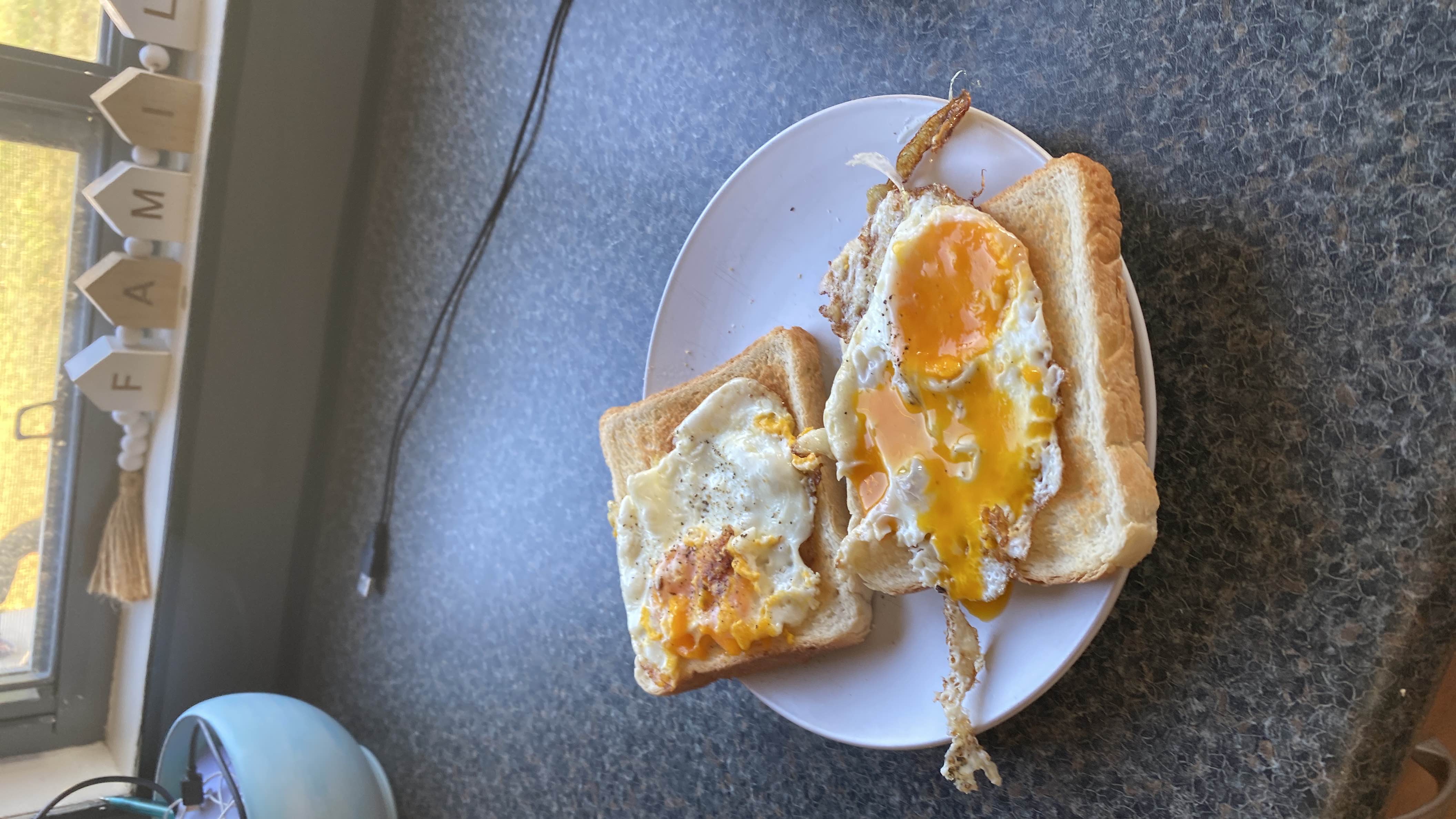 A simple dish consisting of fried eggs served on toasted bread, providing a balance of protein, carbohydrates, and fats.