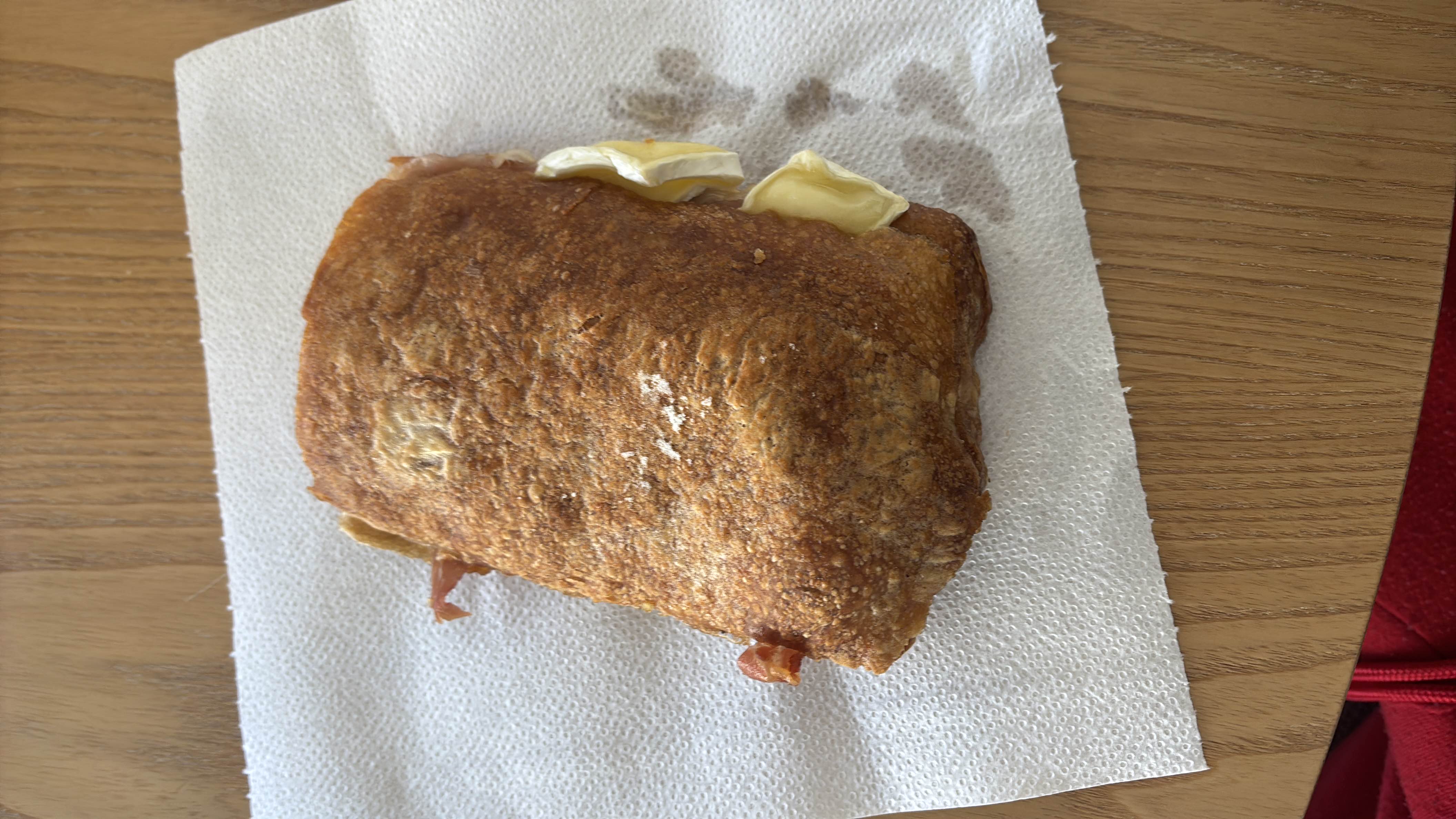 A toasted sandwich with bread, cheese, and ham, providing a balanced mix of protein, carbs, and fats.