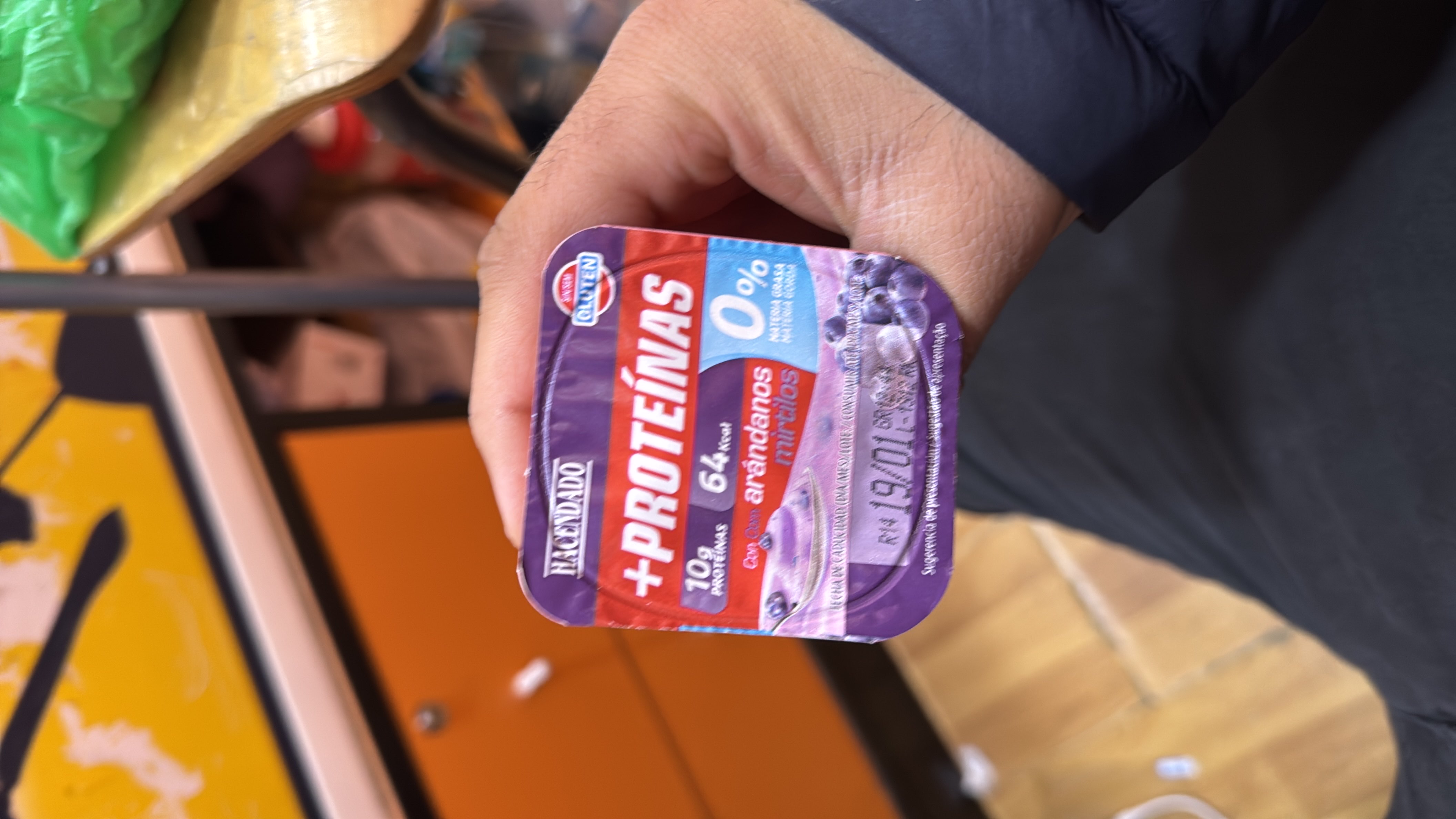 A high-protein, low-calorie yogurt with blueberries, containing 10g of protein and 64 calories per serving.