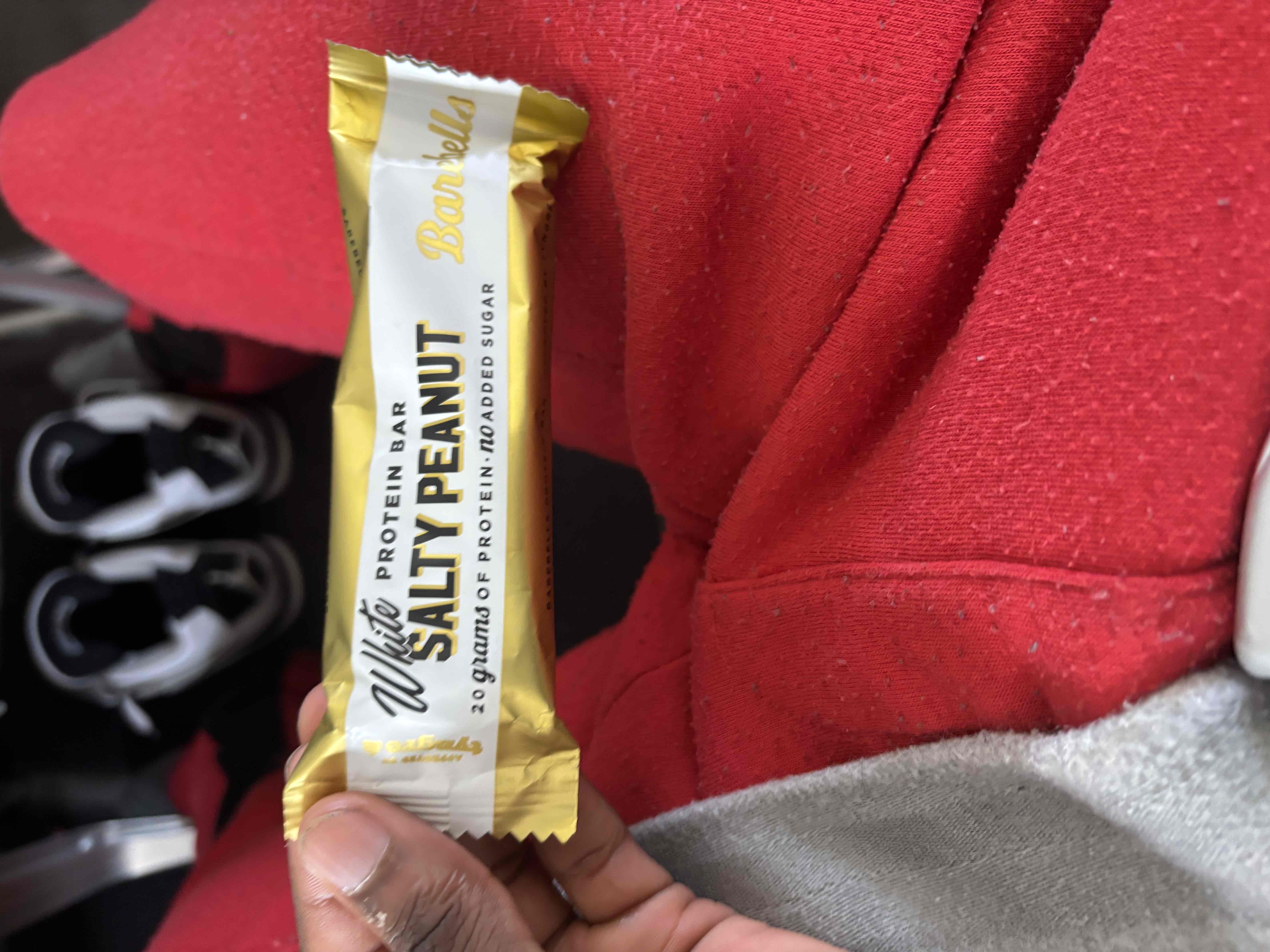A white salty peanut protein bar with 20 grams of protein and no added sugar, offering a balanced nutritional profile.