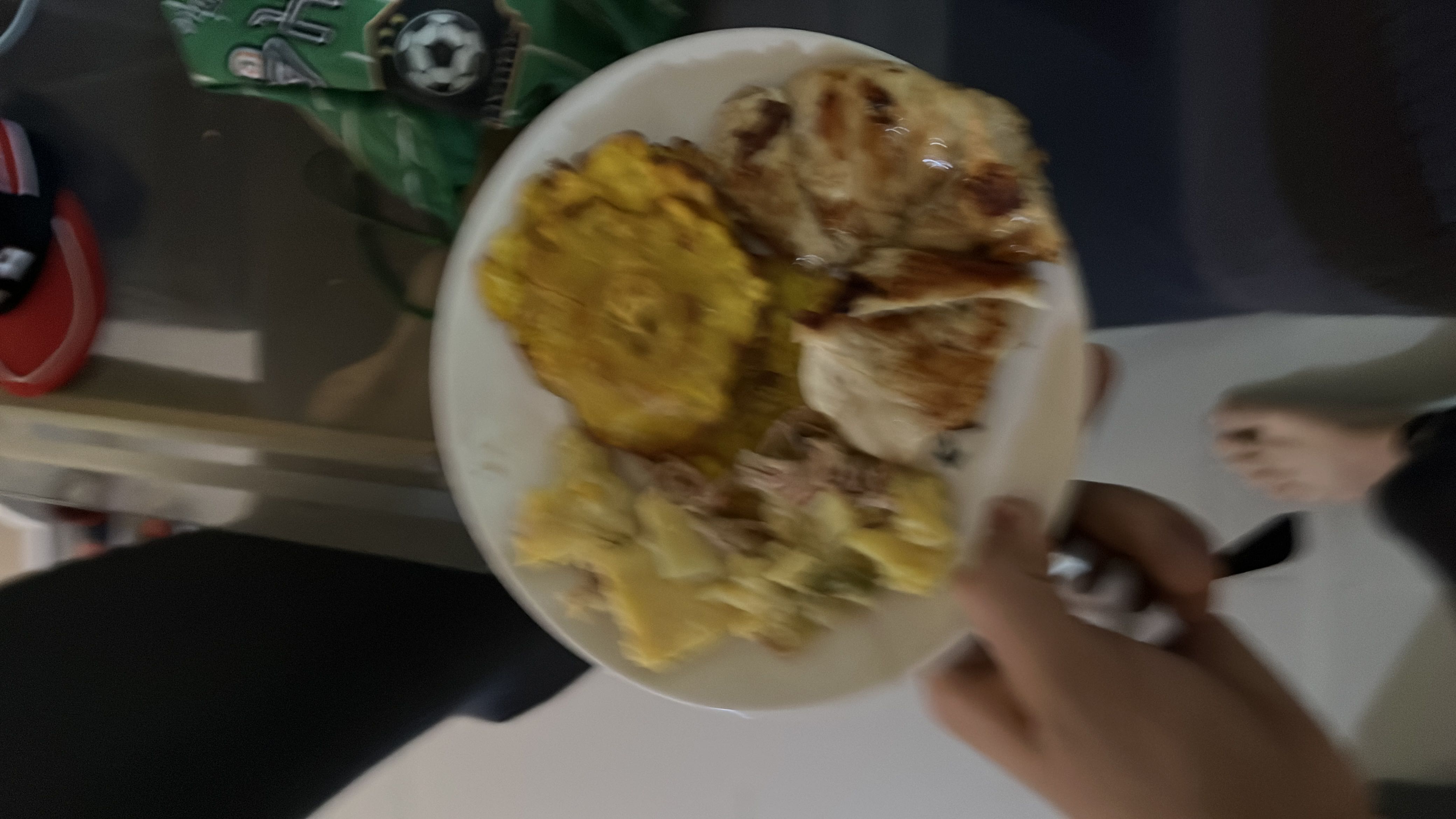 A balanced meal consisting of grilled chicken, fried plantains, and potato salad, providing a mix of protein, carbs, and fats.