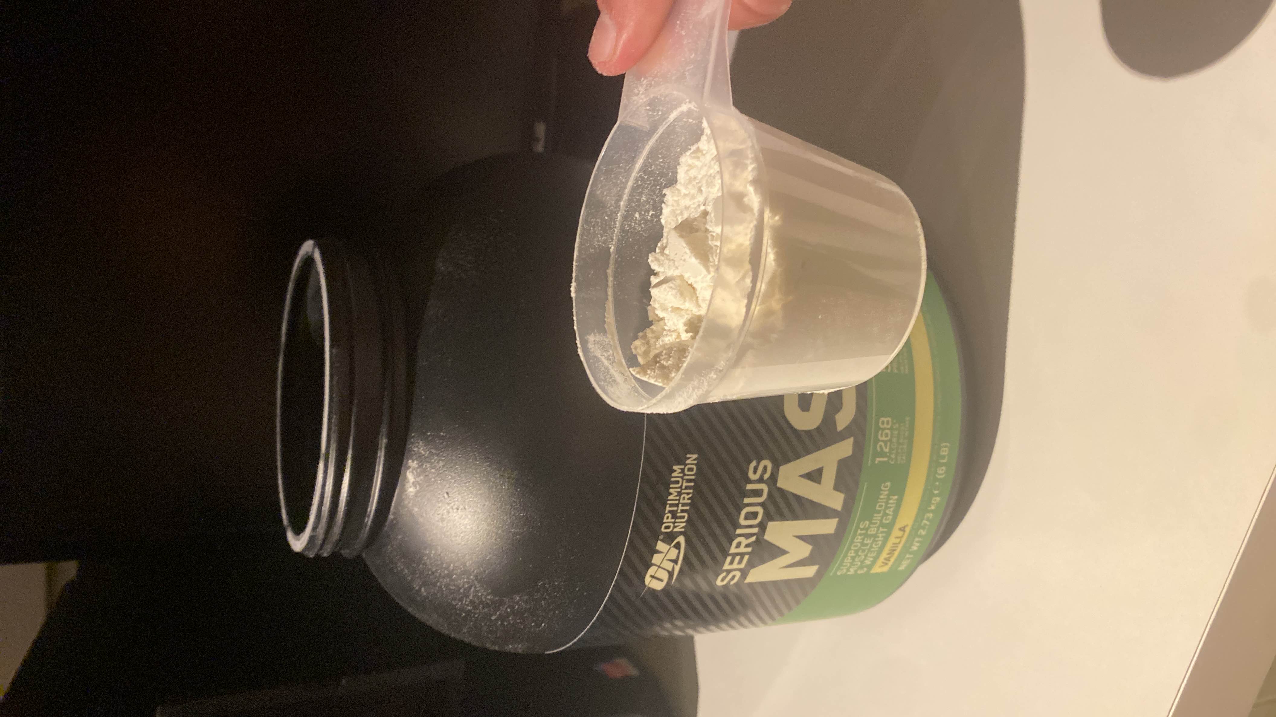Serious Mass is a high-calorie protein powder designed to support muscle building and weight gain, providing 1268 calories per serving with a blend of protein, carbohydrates, and minimal fats.