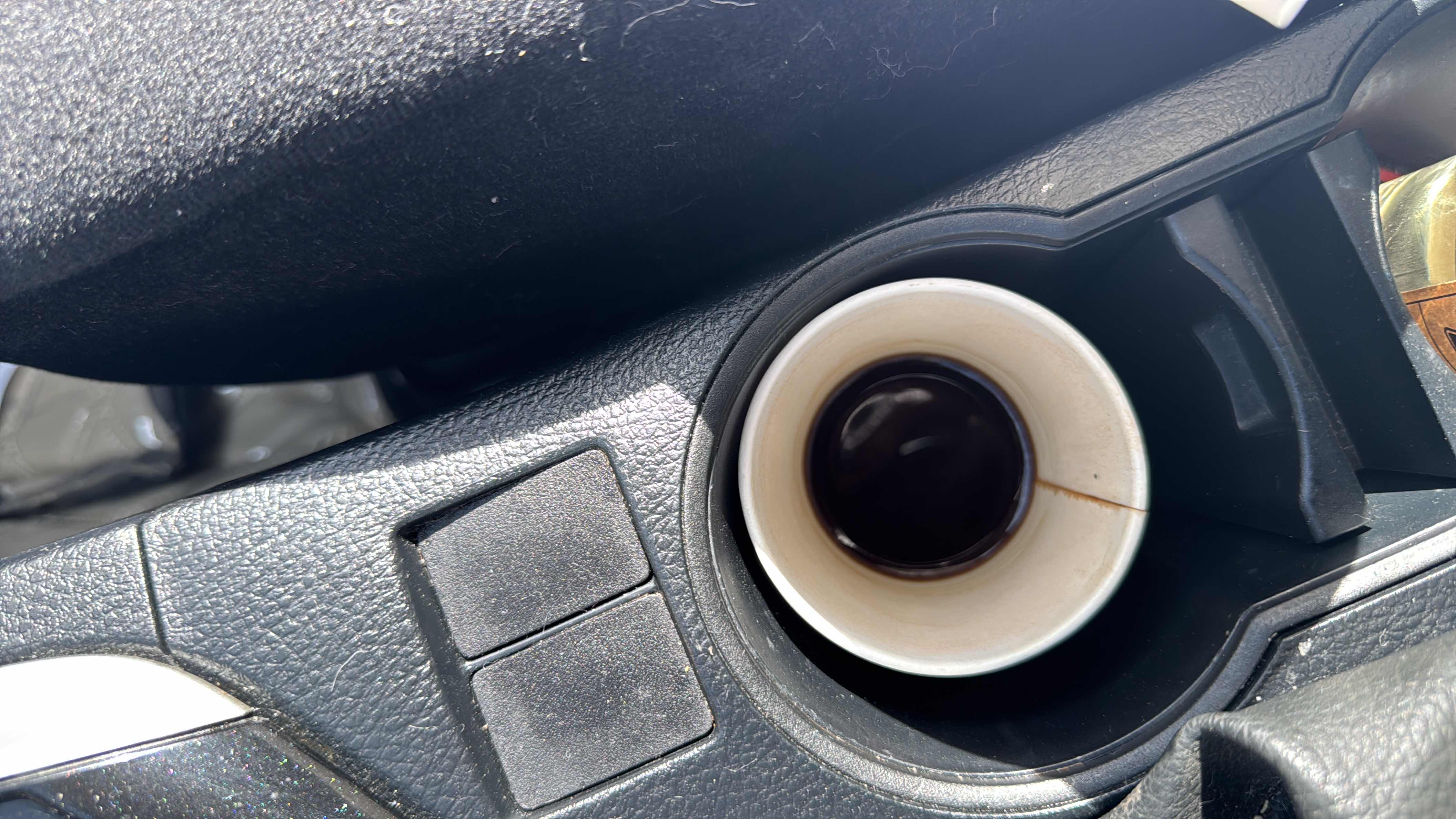 A cup of black coffee with minimal calories and no significant macronutrients.