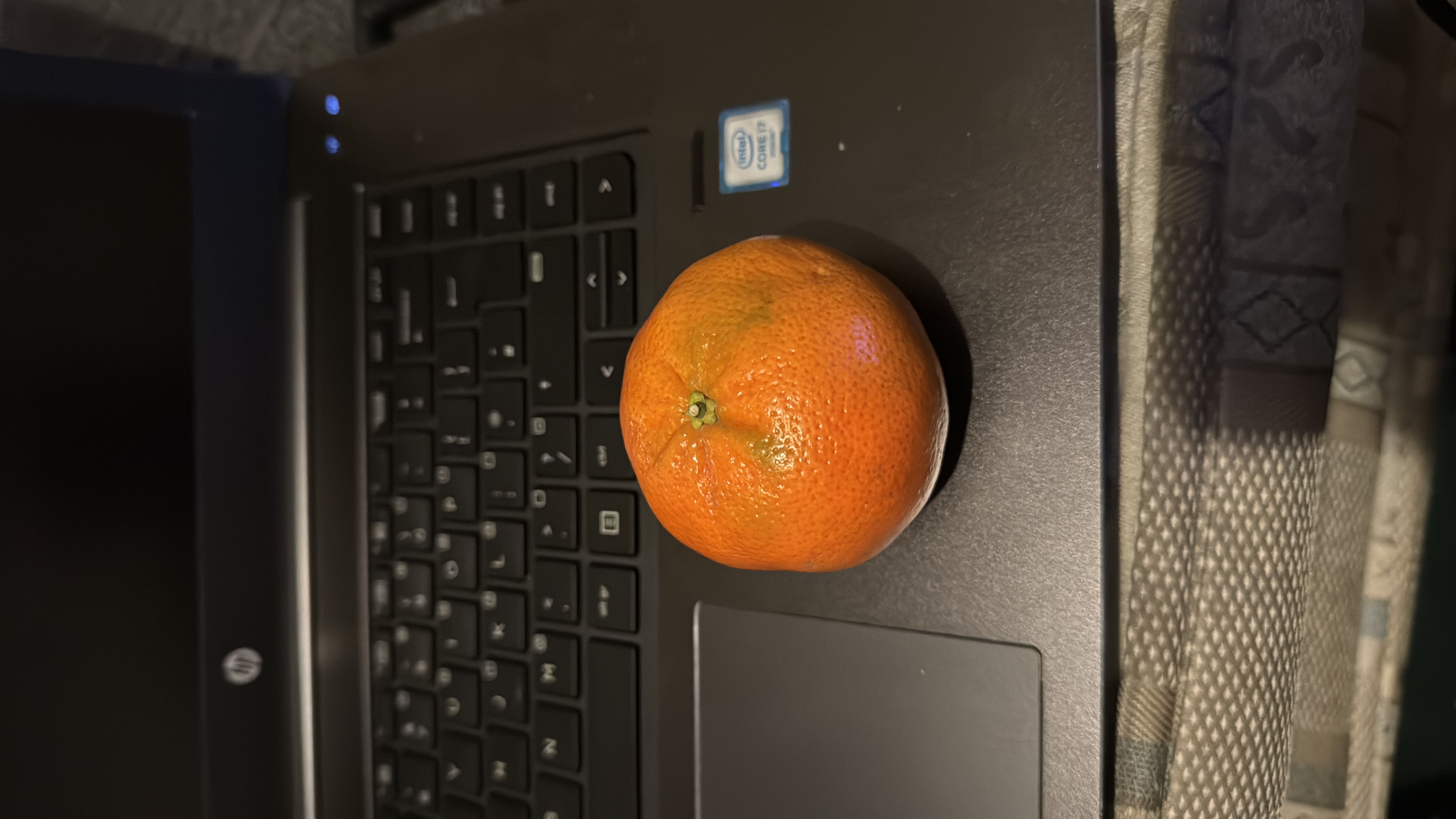 A single mandarin orange, a low-calorie fruit rich in vitamin C and dietary fiber.