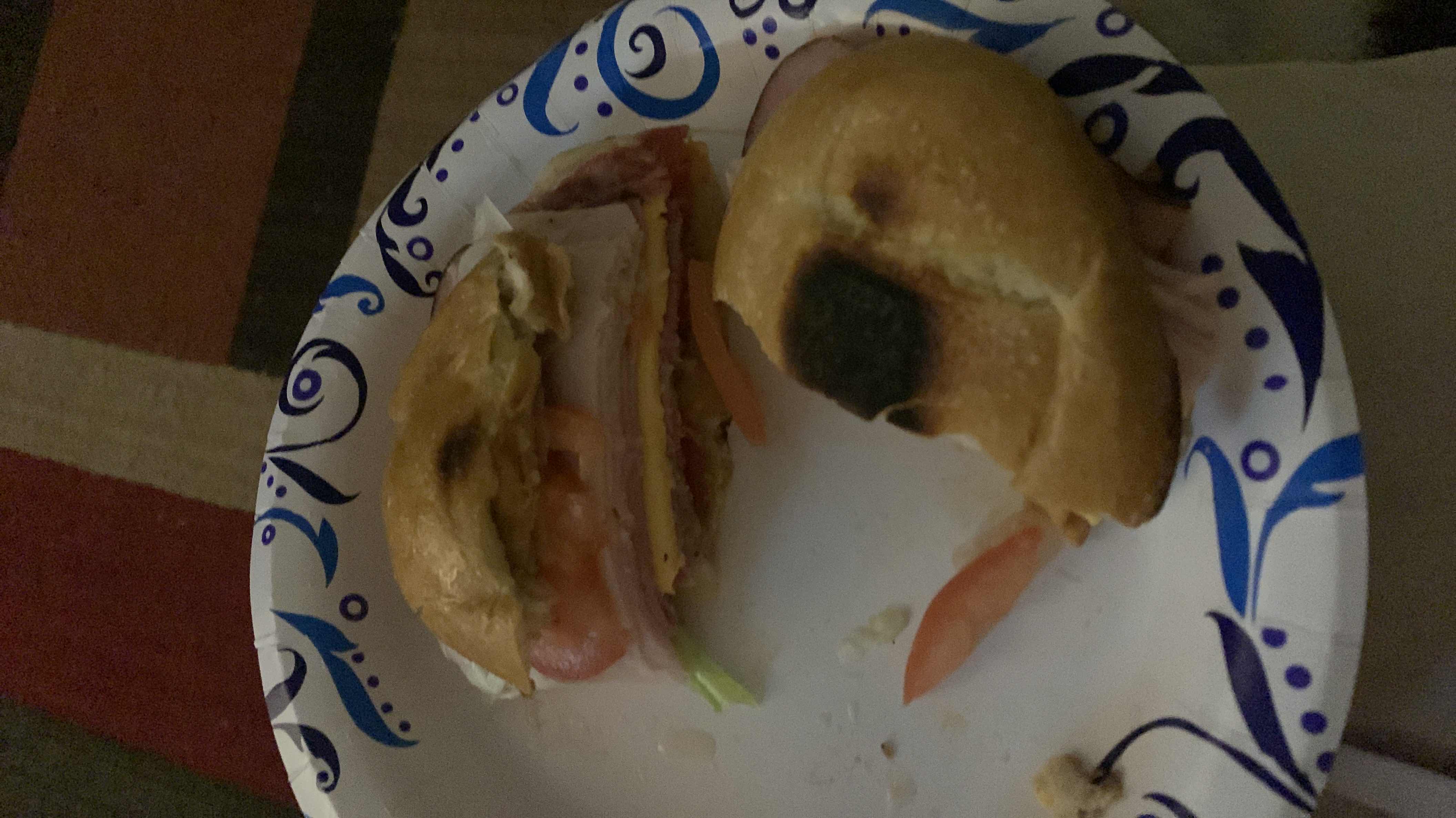A sandwich made with a bagel, turkey slices, cheese, tomato, and lettuce, providing a balanced mix of protein, carbs, and fats.