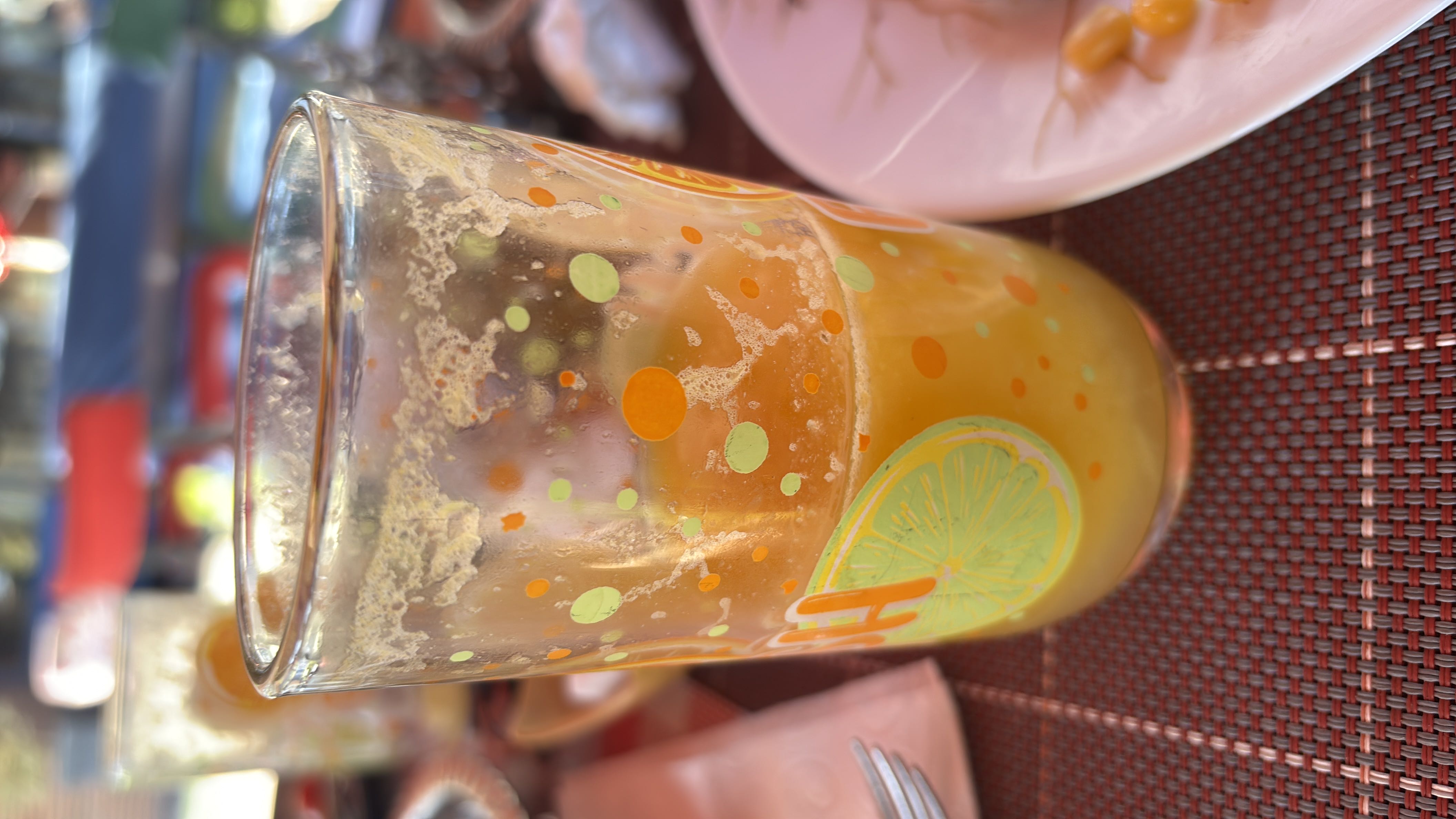 A glass of freshly squeezed orange juice, likely containing natural sugars and vitamin C.