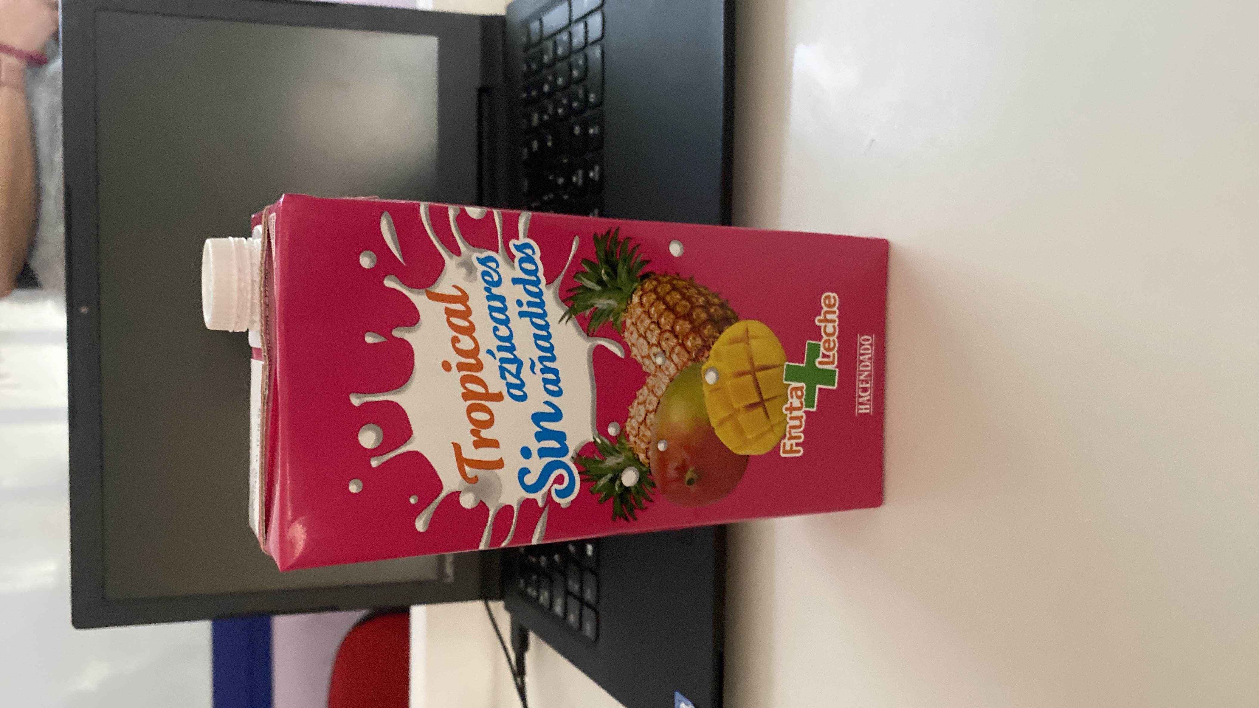 A tropical fruit and milk beverage with no added sugars, featuring pineapple and mango as key ingredients.