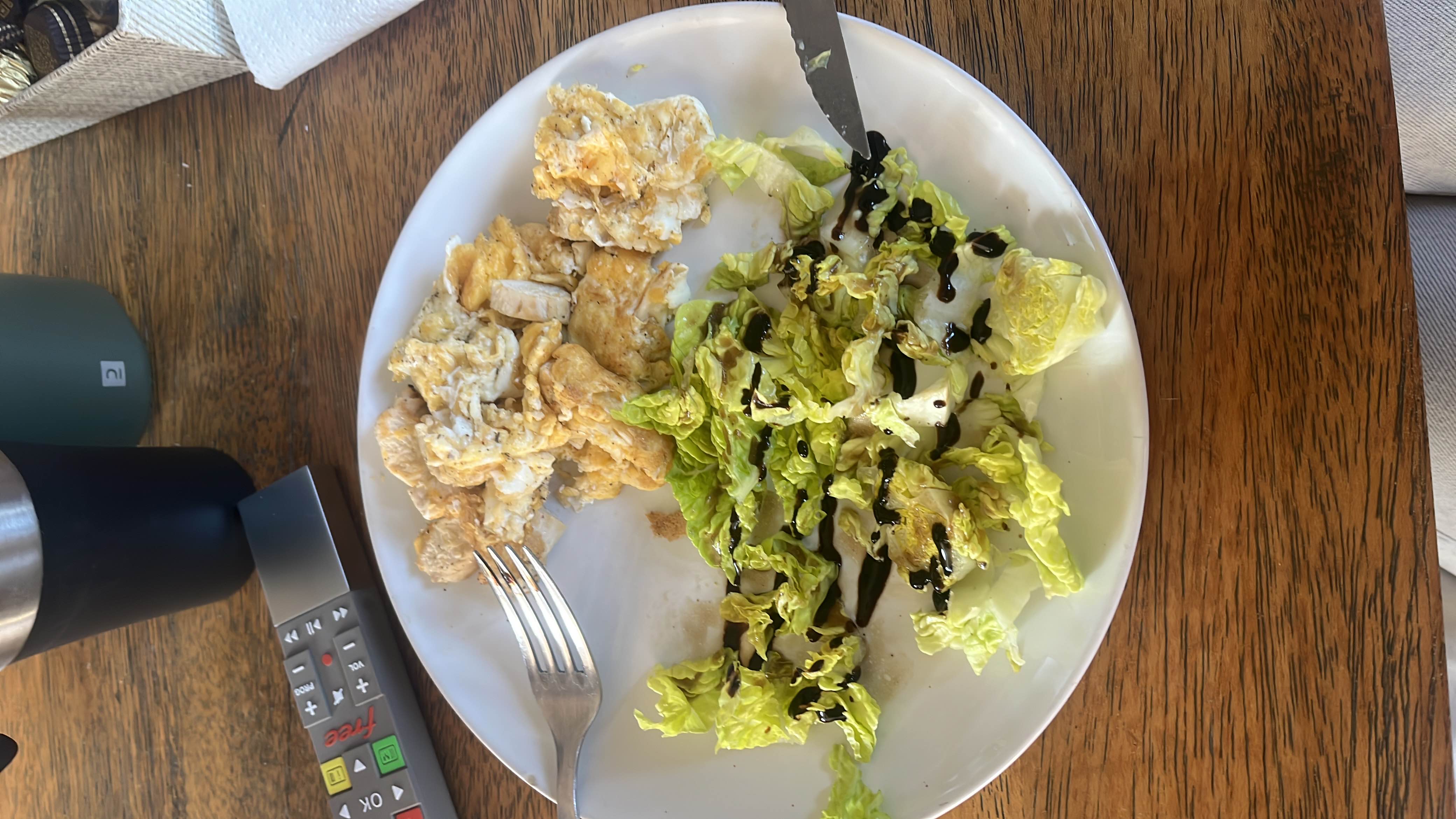A plate of chicken breast and lettuce with balsamic dressing, providing a balanced meal with moderate calories and a good health score.