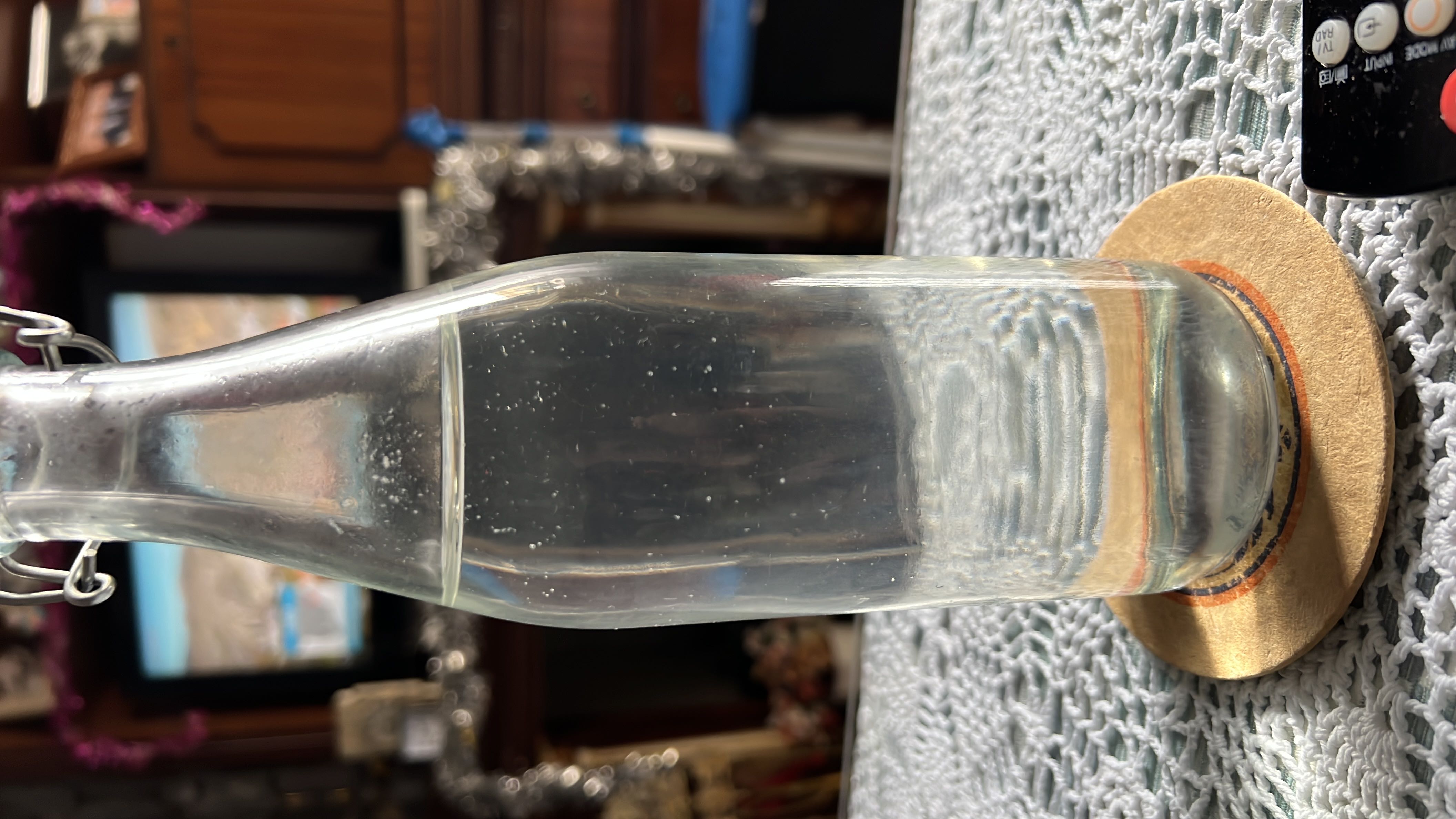 A bottle of clear water, which is calorie-free and contains no macronutrients.