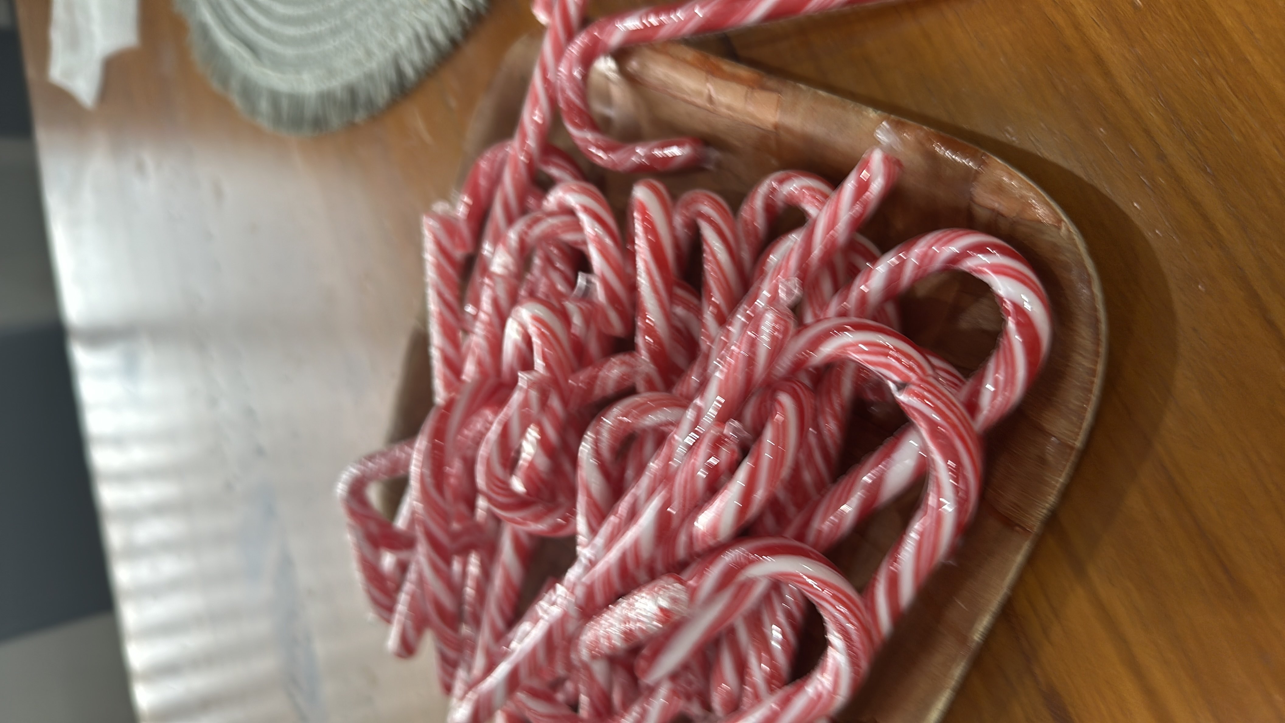 The image shows a tray of candy canes, which are primarily made of sugar and contain minimal nutritional value.