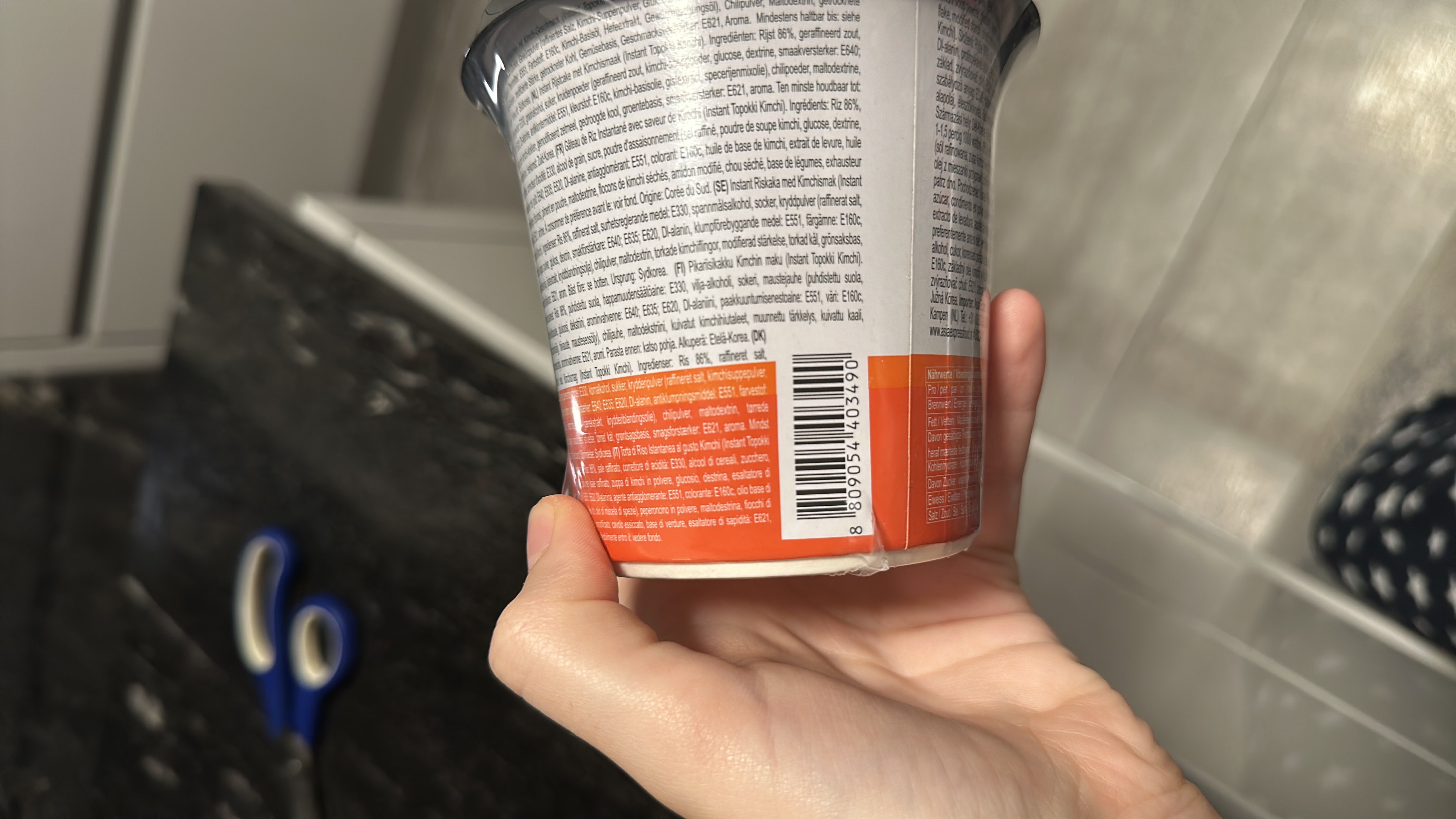 The image contains a food product with nutritional information, but the text is not fully legible to extract specific details.